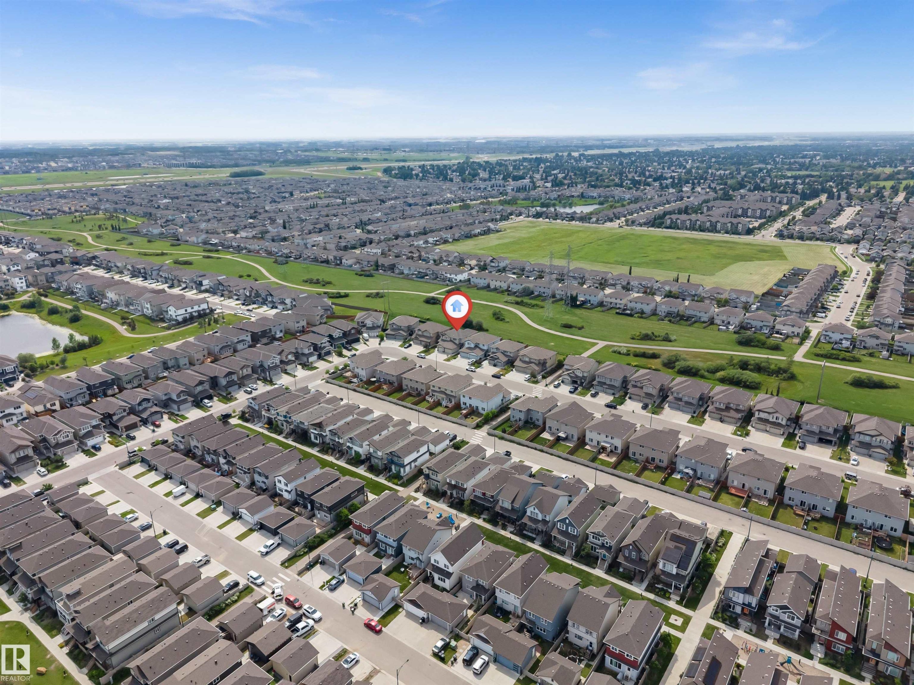 Aerial perspective showcasing a residential development with numerous single-family homes - 1712 27 St Nw, Edmonton, AB - Outdoor With View