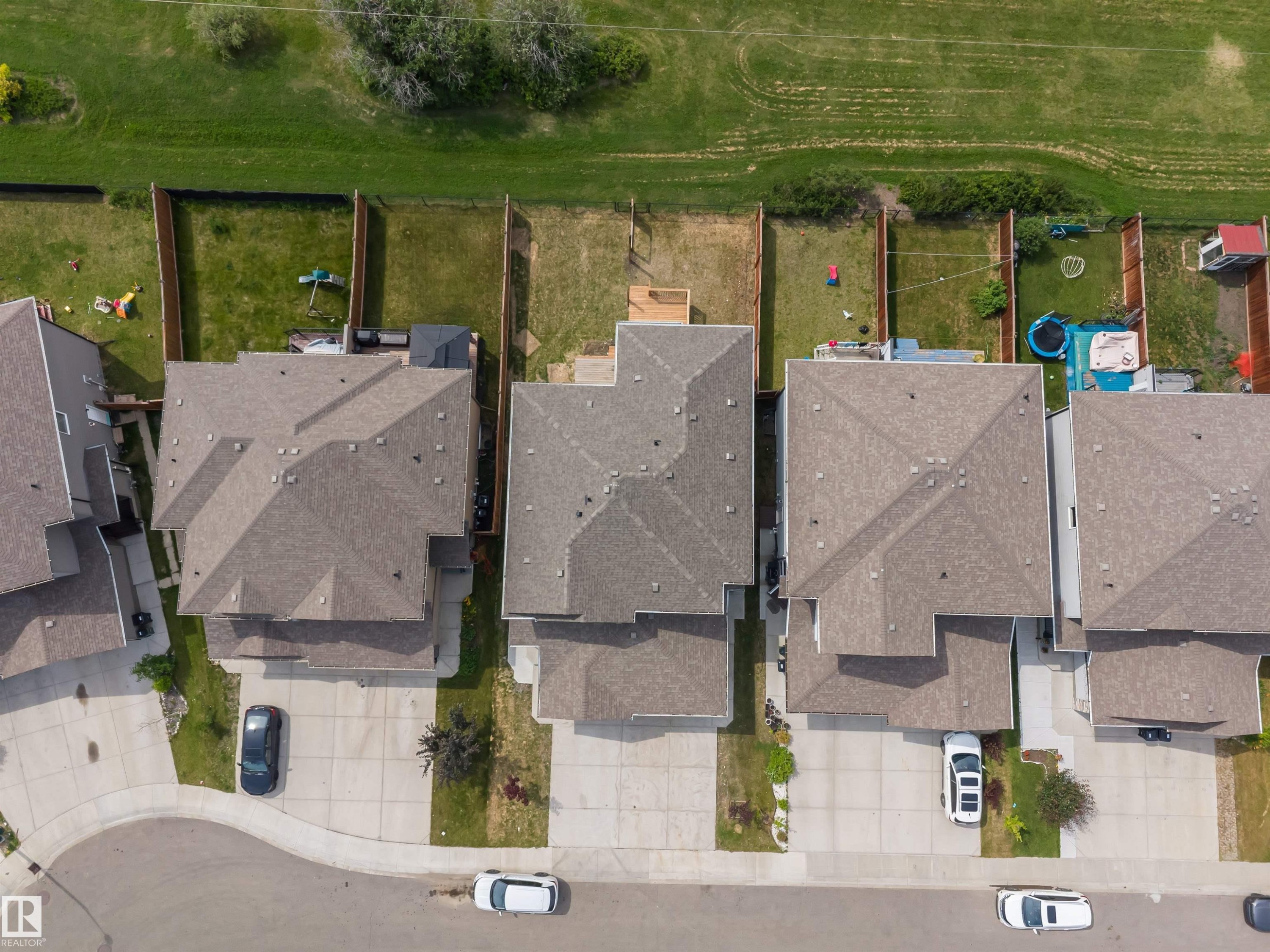 Aerial perspective showcasing a residential property with a multi-level roofline and an attached garage - 1714 27 St. Nw, Edmonton, AB - Outdoor