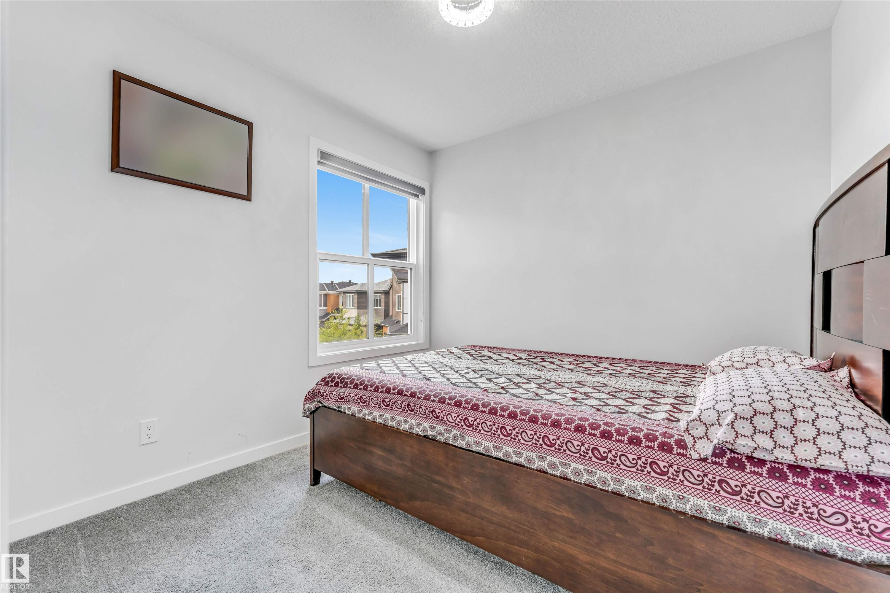White walls complemented by light gray carpeting - 425 41 Street, Edmonton, AB - Indoor Photo Showing Bedroom
