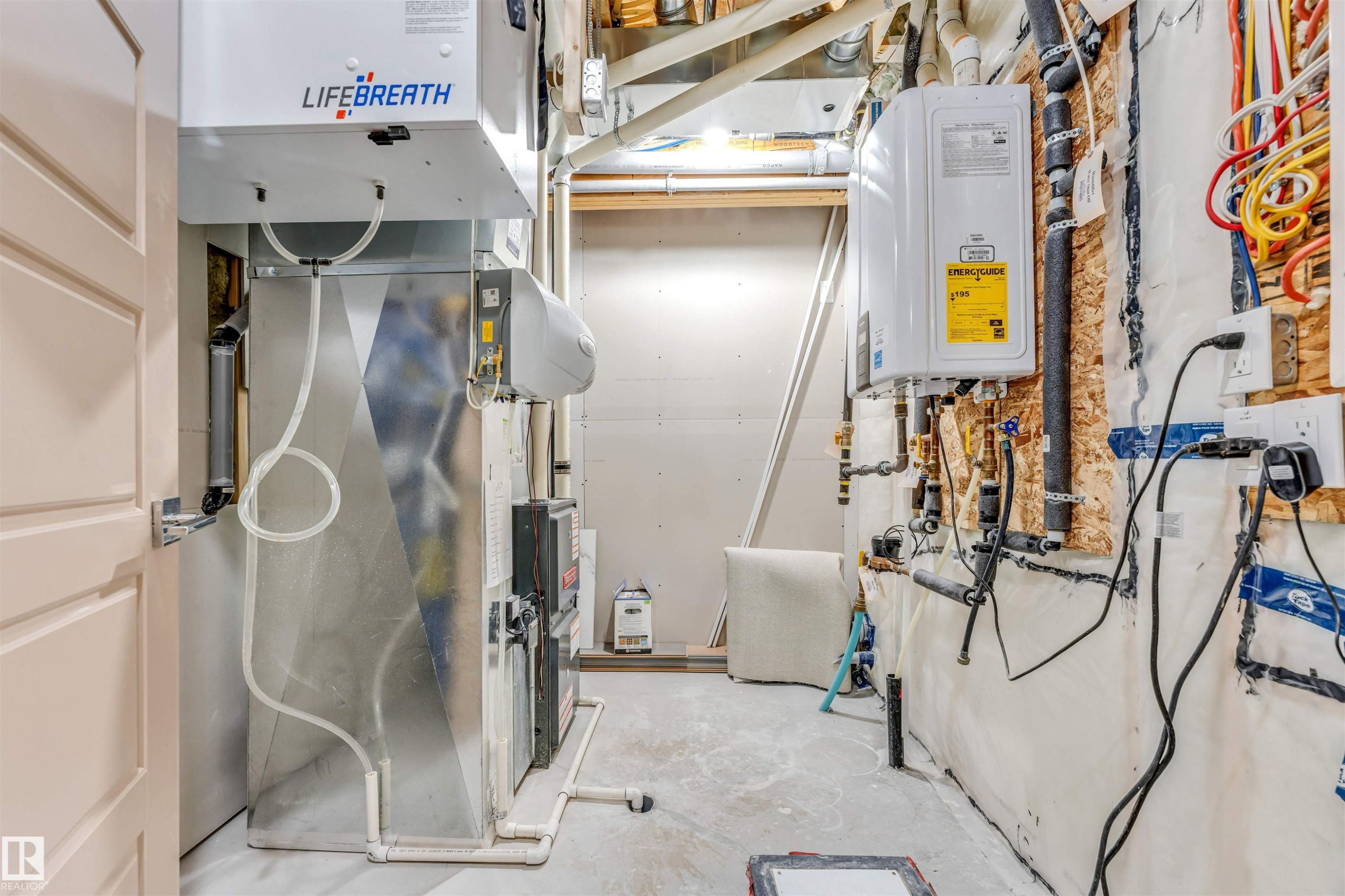 Utility room featuring a furnace, water heater, ventilation system, and exposed electrical conduits - 425 41 Street, Edmonton, AB - Indoor Photo Showing Basement