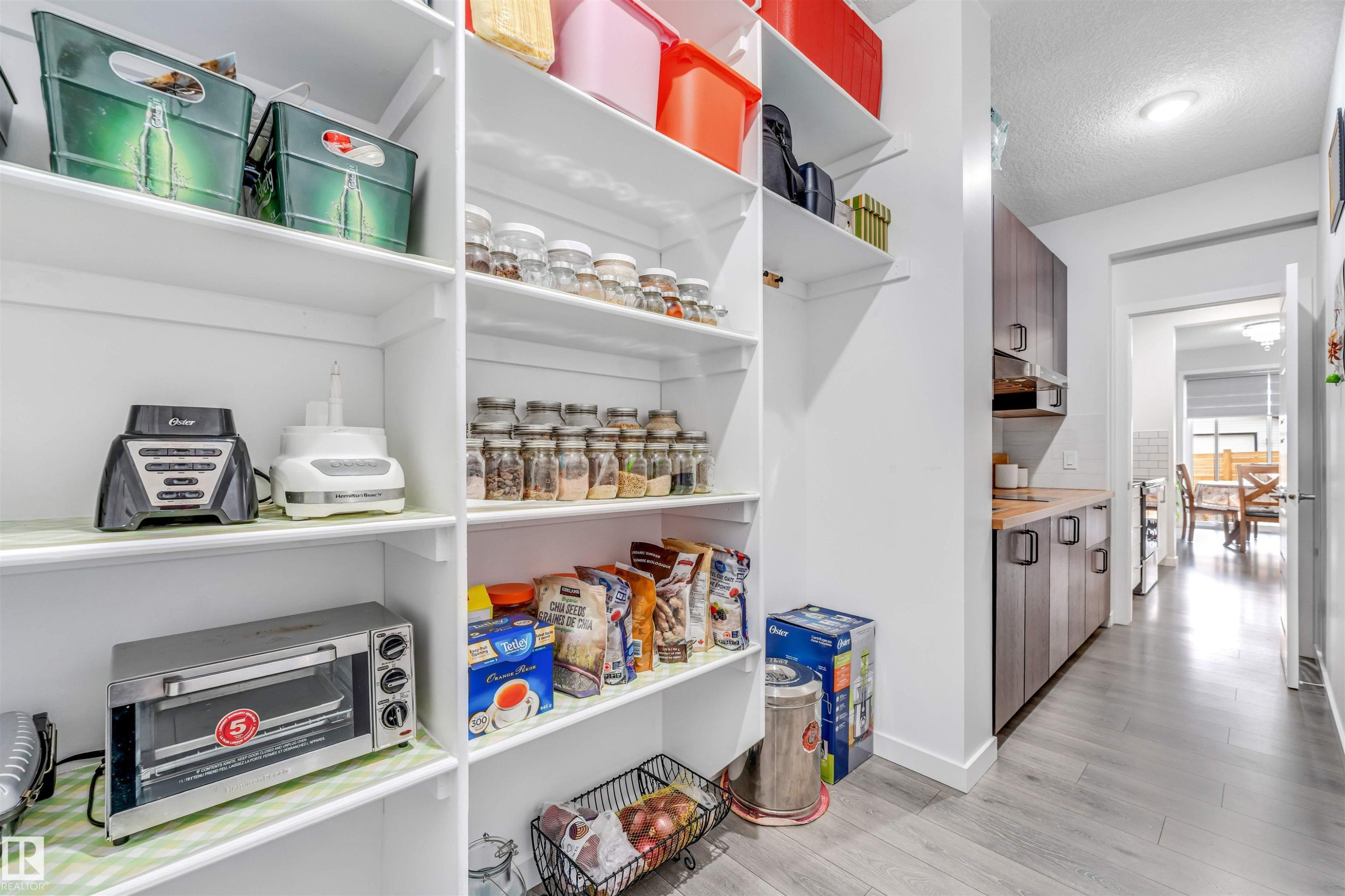 Built-in pantry shelving featuring multiple tiers for organized storage - 425 41 Street, Edmonton, AB - Indoor