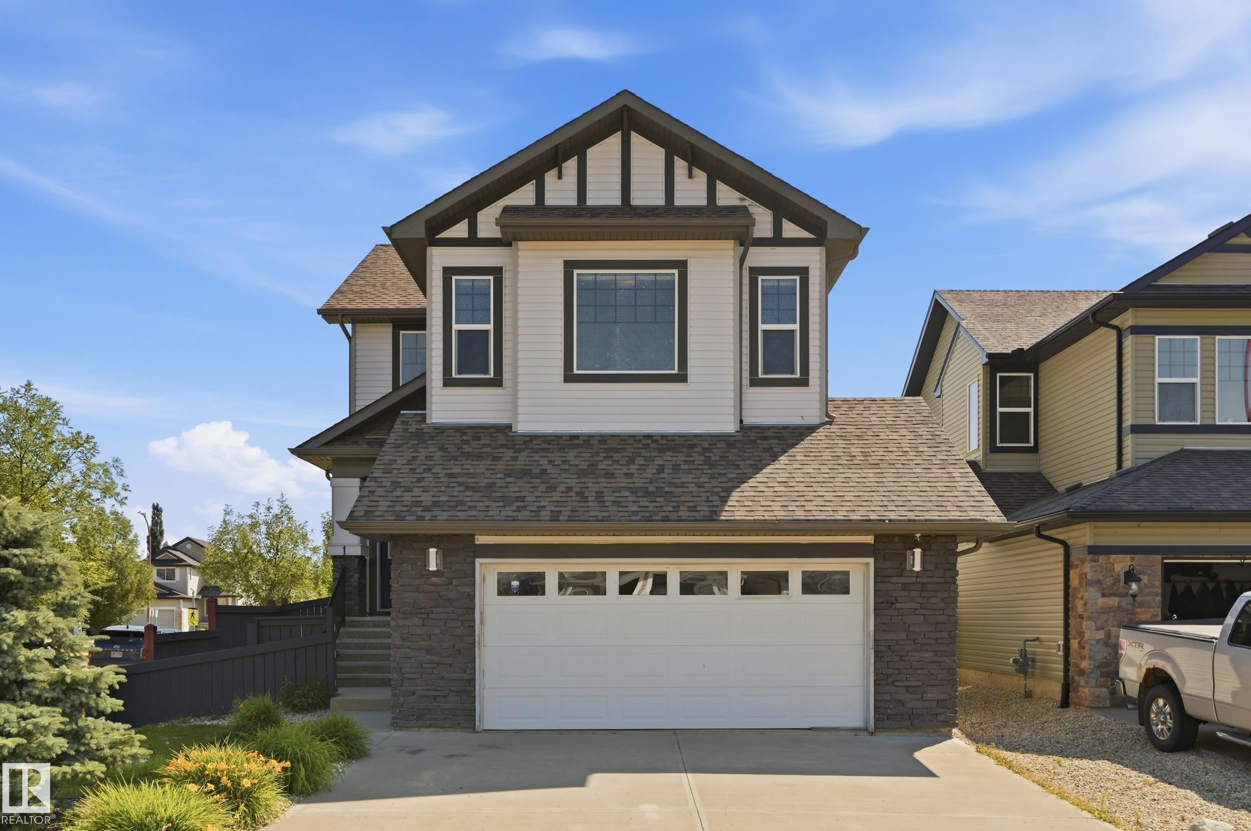 Two-story property featuring a stone and siding facade - 1 Southfork Close, Leduc, AB - Outdoor