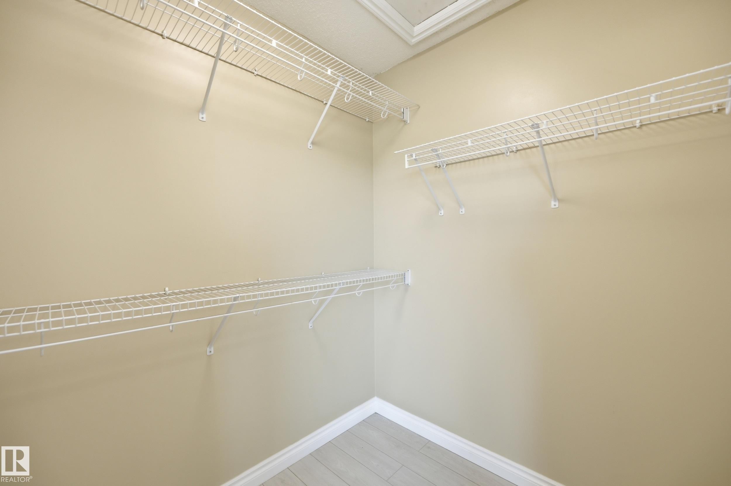 Walk-in closet with multiple levels of wire shelving - 1 Southfork Close, Leduc, AB - Indoor With Storage