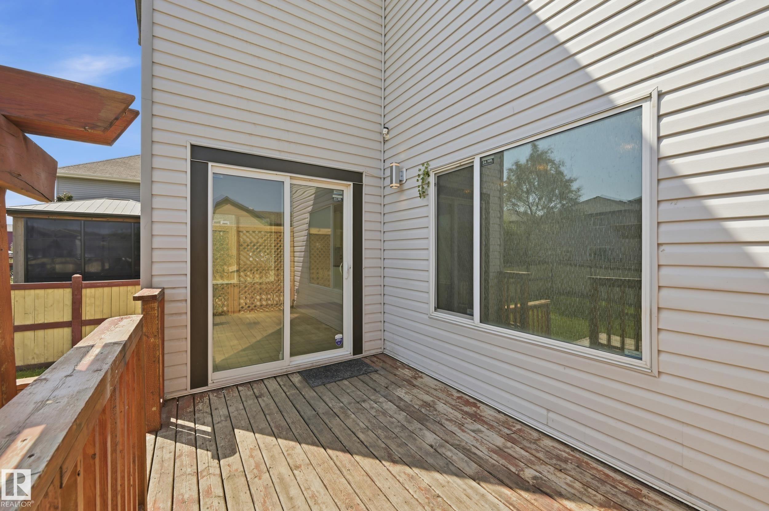 Wood-finish decking with railings and a partial pergola structure - 1 Southfork Close, Leduc, AB - Outdoor With Deck Patio Veranda With Exterior