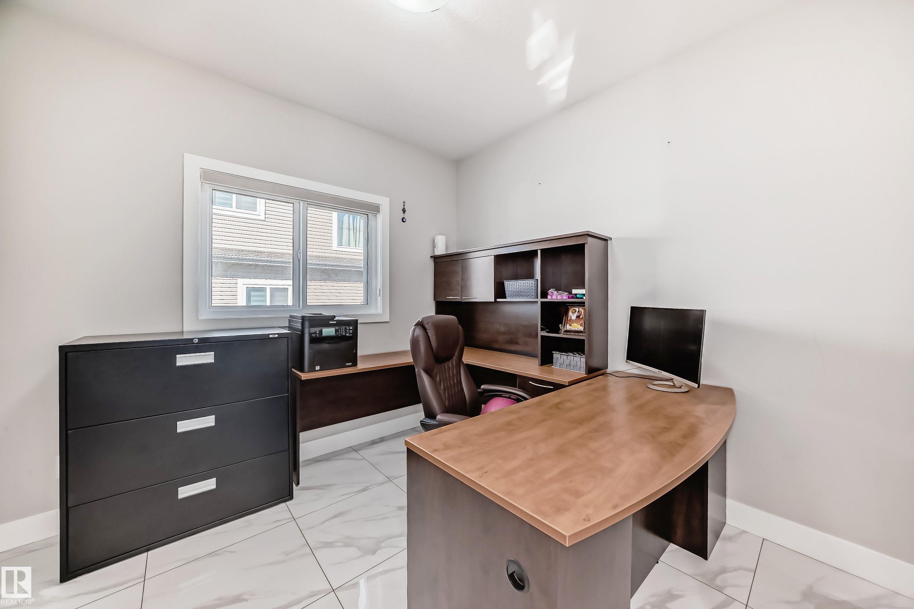 Room featuring light-toned walls, white trim, and white tile flooring - 2464 15 Avenue Nw, Edmonton, AB - Indoor Photo Showing Office