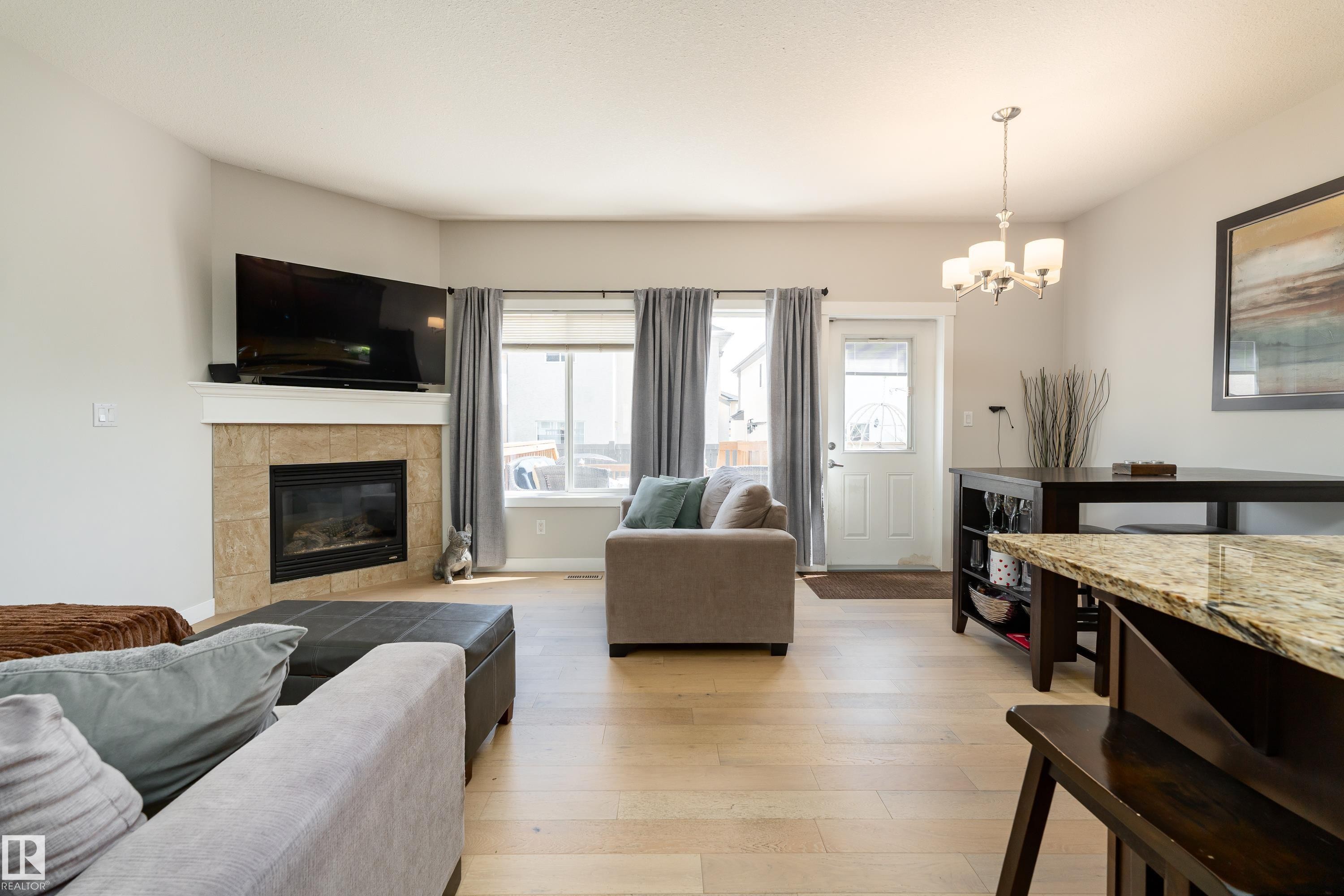 16805 55 Street Nw, Edmonton, AB - Indoor Photo Showing Living Room With Fireplace