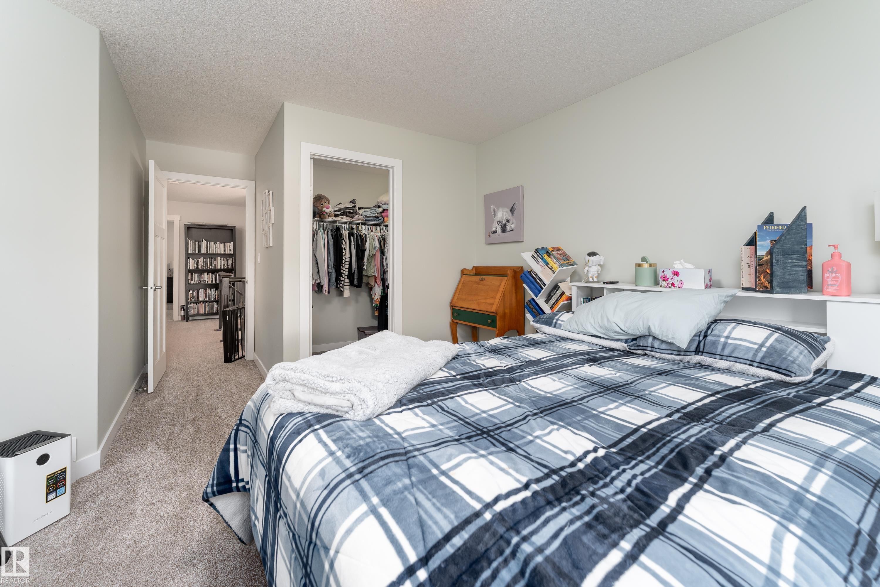 Bedroom featuring light-toned carpeting and neutral wall paint - 16805 55 Street Nw, Edmonton, AB - Indoor Photo Showing Bedroom