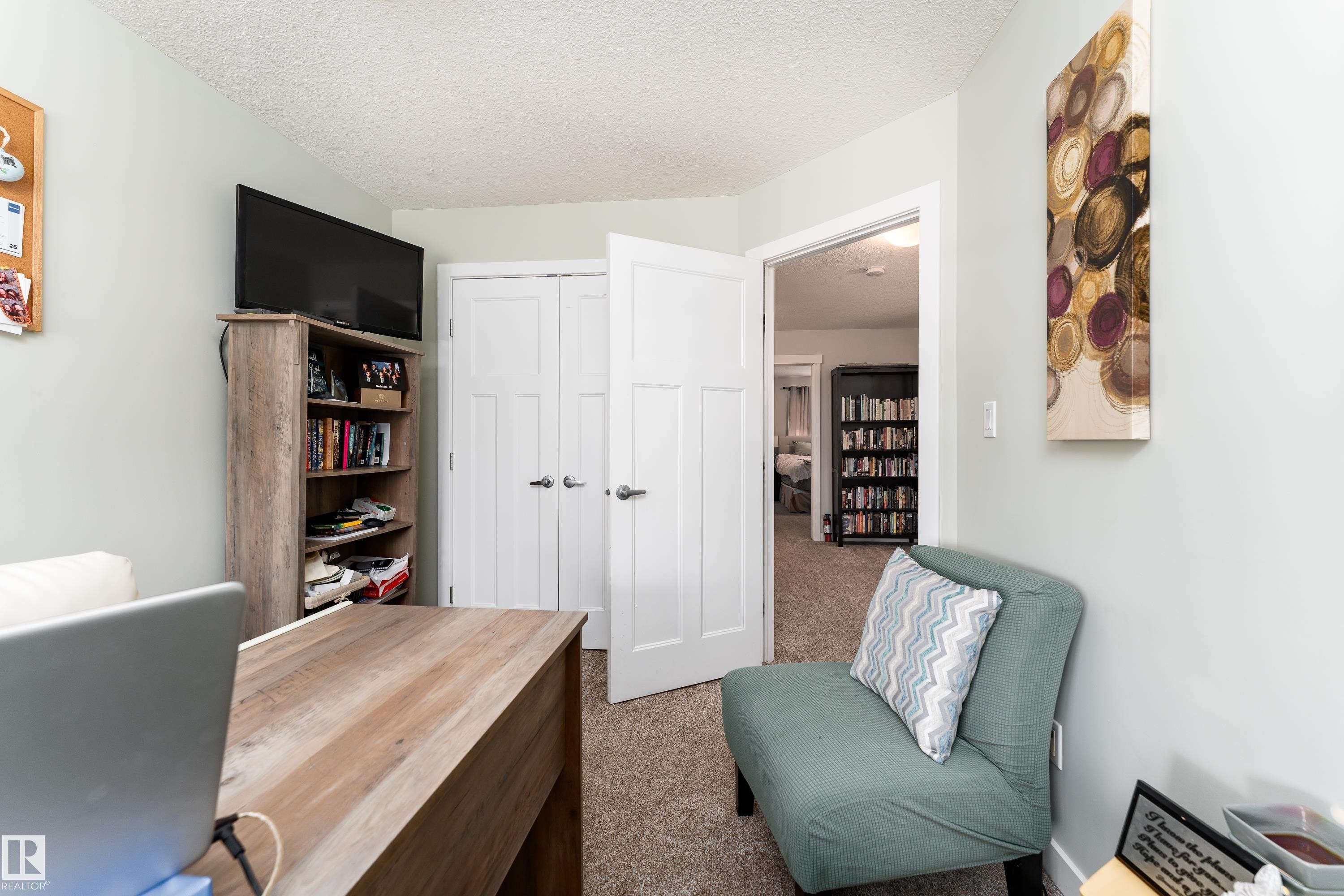 Neutral-toned wall paint and carpeted flooring define this interior space - 16805 55 Street Nw, Edmonton, AB - Indoor Photo Showing Bedroom