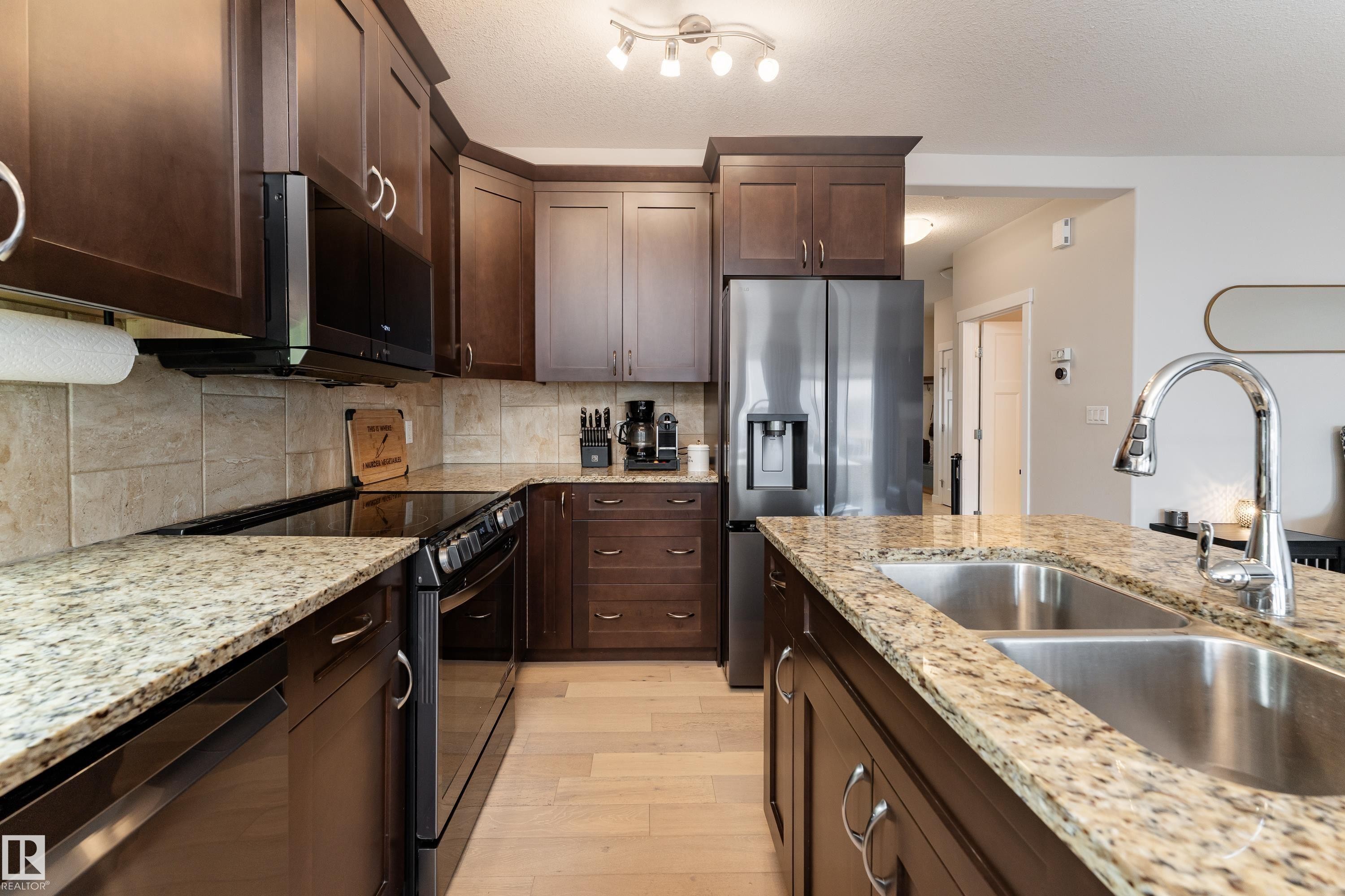 16805 55 Street Nw, Edmonton, AB - Indoor Photo Showing Kitchen With Double Sink