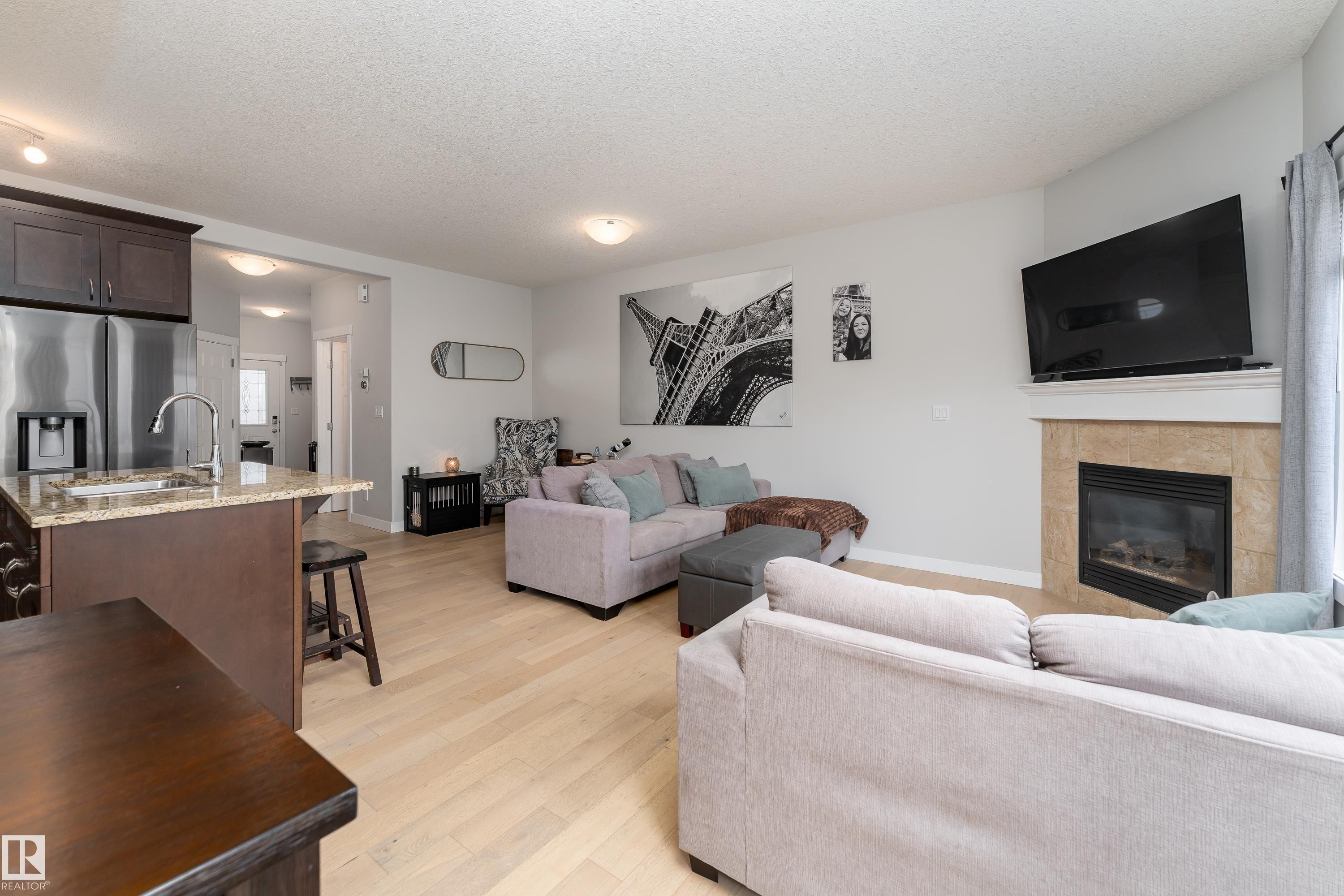 16805 55 Street Nw, Edmonton, AB - Indoor Photo Showing Living Room With Fireplace