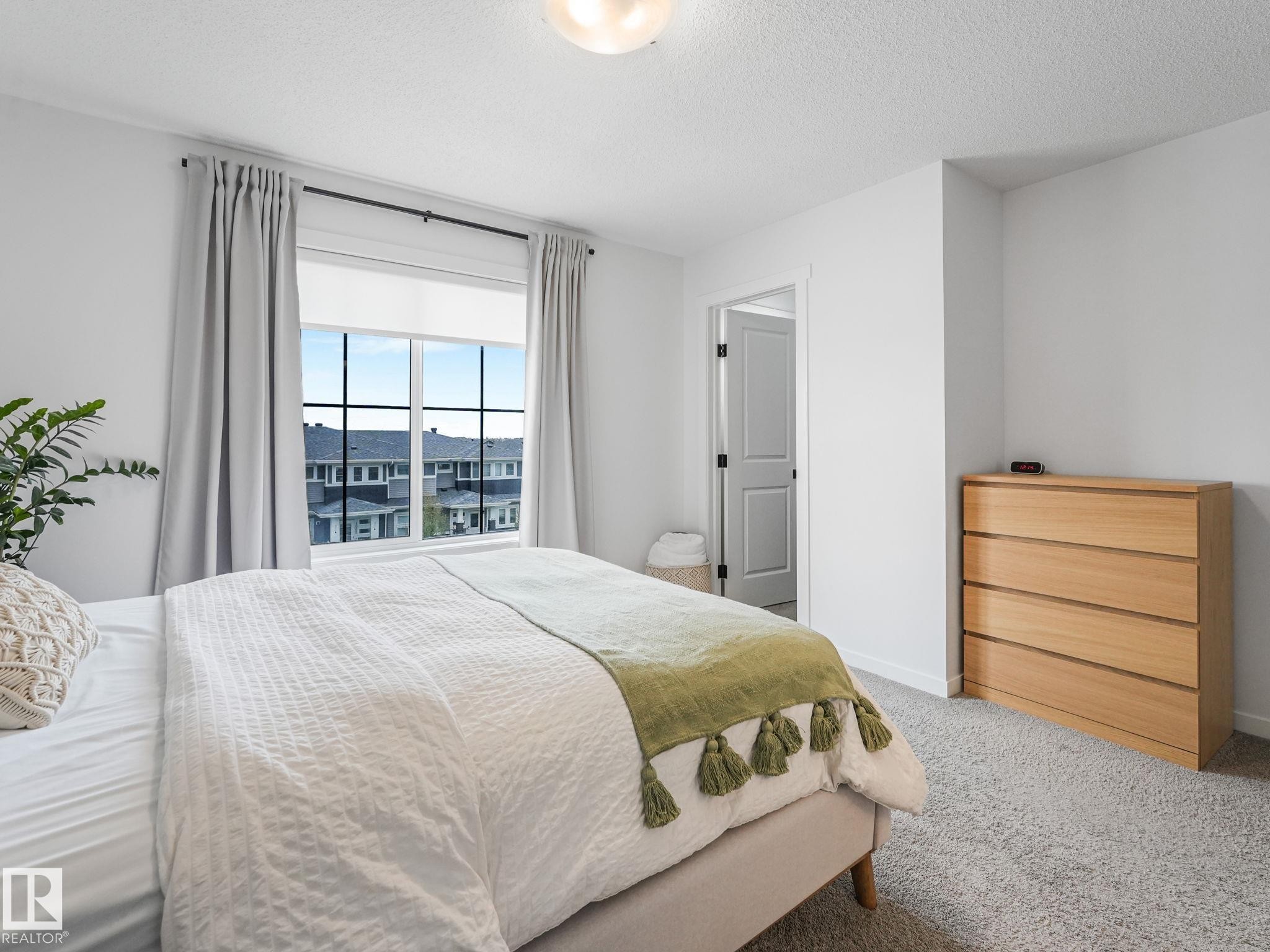 1061 Cy Becker Road Nw, Edmonton, AB - Indoor Photo Showing Bedroom