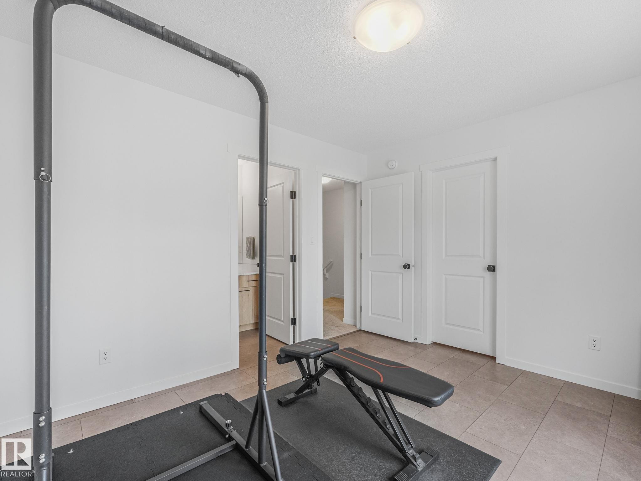1061 Cy Becker Road Nw, Edmonton, AB - Indoor Photo Showing Gym Room