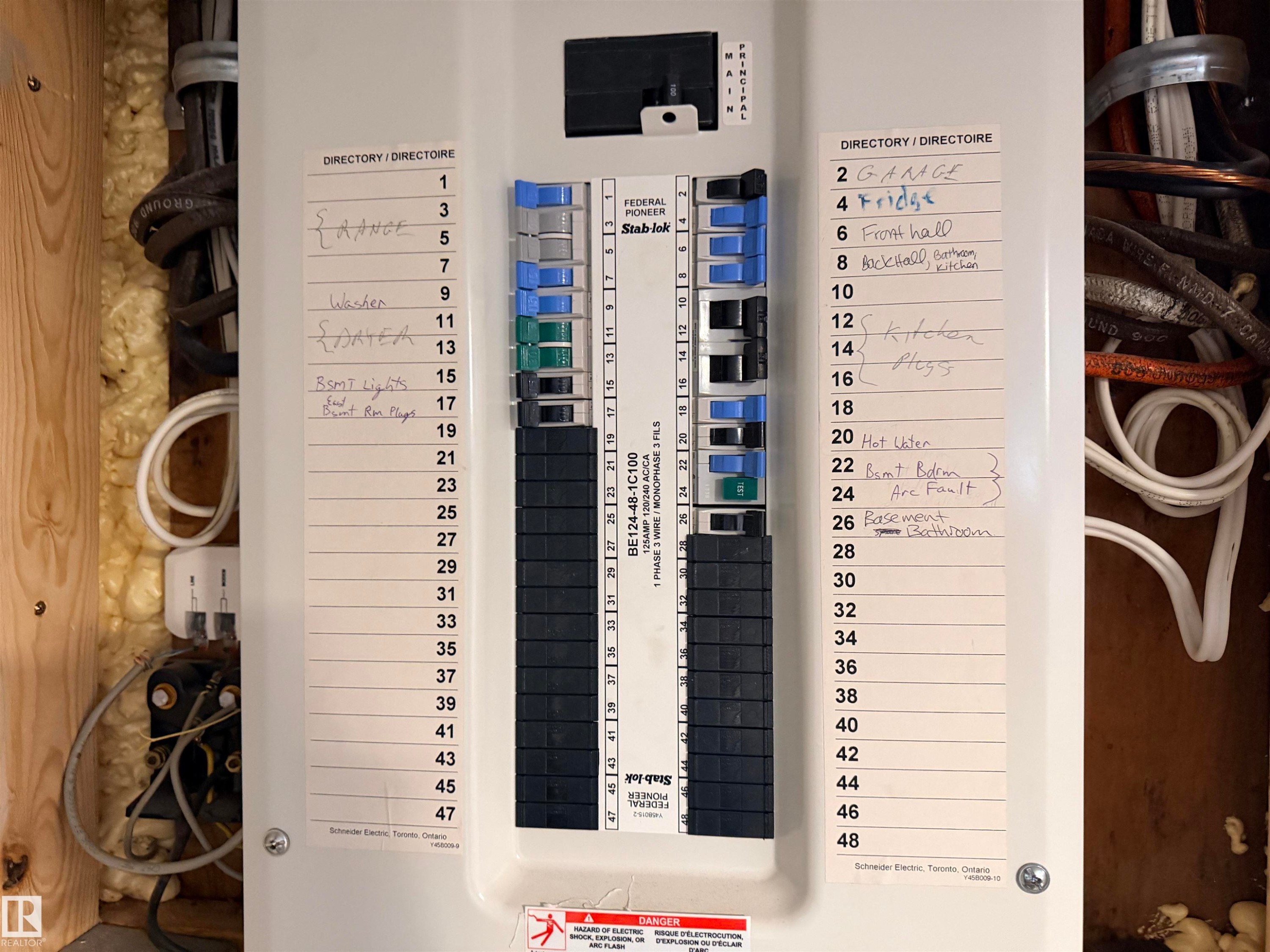 Electrical panel featuring multiple circuit breakers and labeled circuits - 4823 49 Street, Clyde, AB -