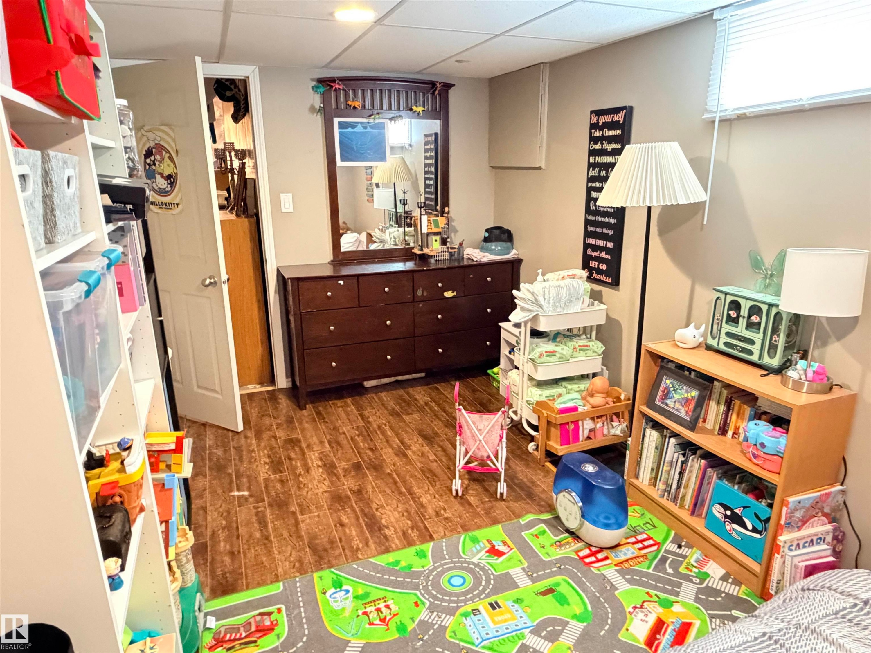 Recessed lighting illuminates wood-finish flooring - 4823 49 Street, Clyde, AB - Indoor
