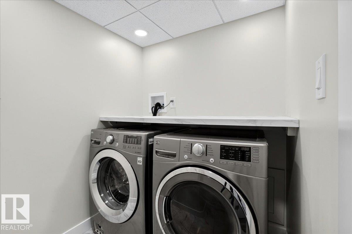 Dedicated laundry area featuring a light-toned countertop, recessed lighting, and a neutral color palette - 4212 32 Avenue Nw, Edmonton, AB - Indoor Photo Showing Laundry Room