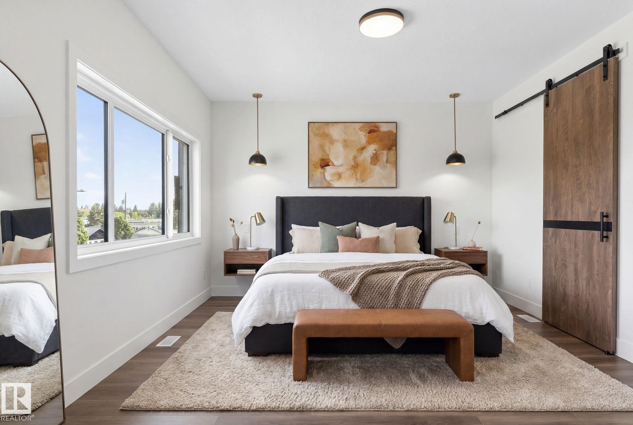 Bedroom featuring wood-finish flooring, a contemporary ceiling light fixture, and a large window - 5308 103A Avenue, Edmonton, AB - Indoor Photo Showing Bedroom
