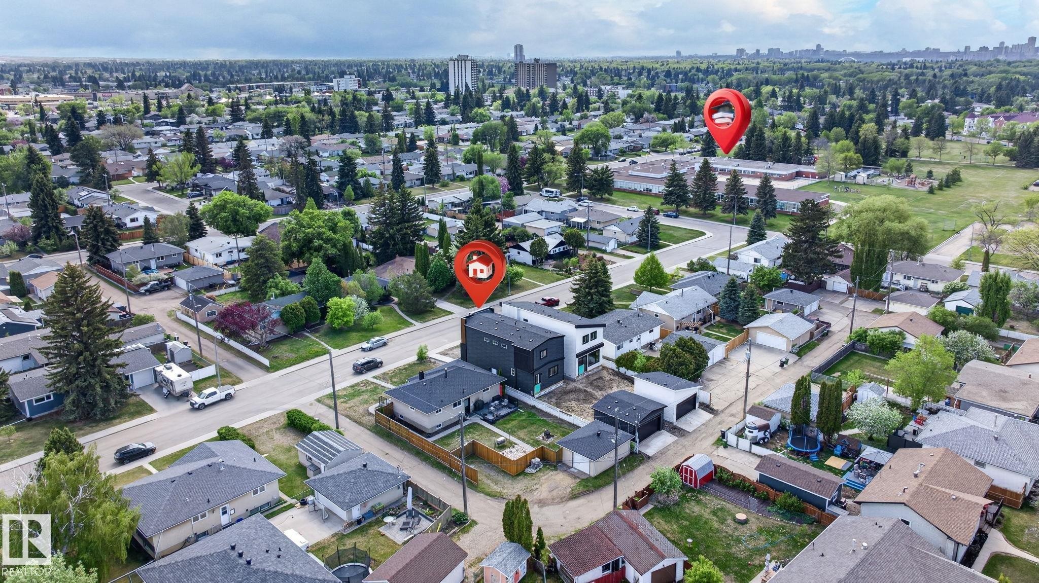Aerial perspective showcasing a residential neighborhood with a mix of established homes and newer construction - 5308 103A Avenue, Edmonton, AB - Outdoor With View