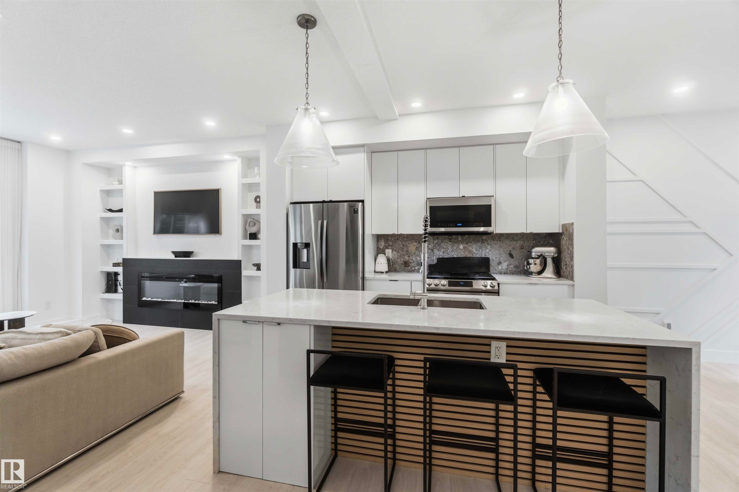 Welcome to #67 230 Edgemont Road NW - #67 230 Edgemont Rd Nw, Edmonton, AB - Indoor Photo Showing Kitchen With Fireplace With Double Sink With Upgraded Kitchen
