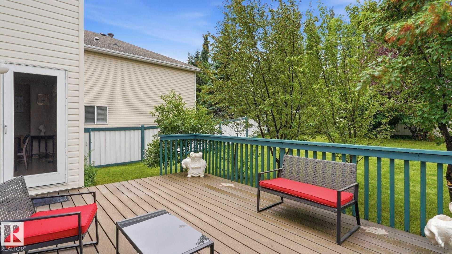Wood-finish deck with a painted railing system - 125 Dechene Road Nw, Edmonton, AB - Outdoor With Deck Patio Veranda With Exterior