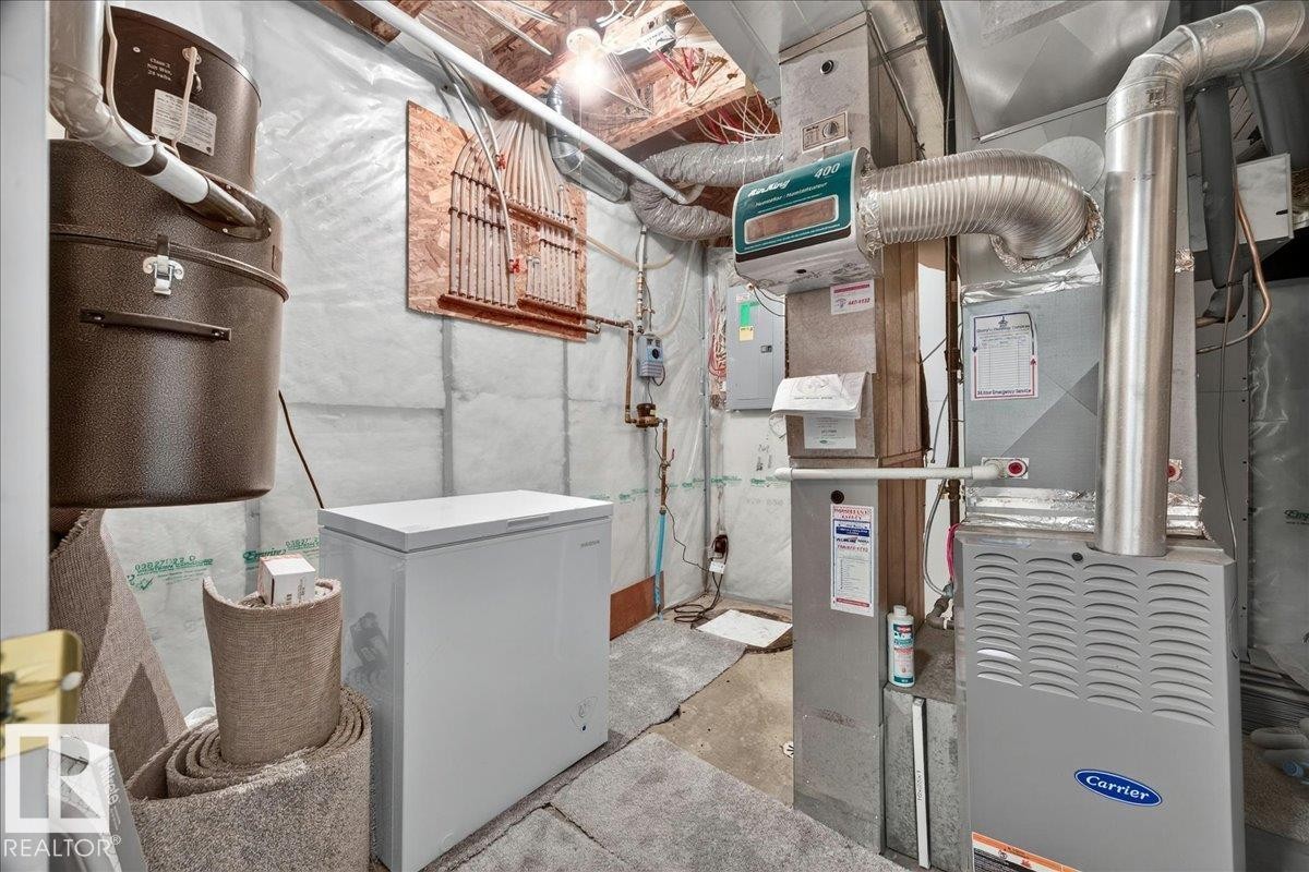 Carrier brand furnace system with attached ductwork and ventilation - 6 Norfolk Close, St. Albert, AB - Indoor Photo Showing Basement