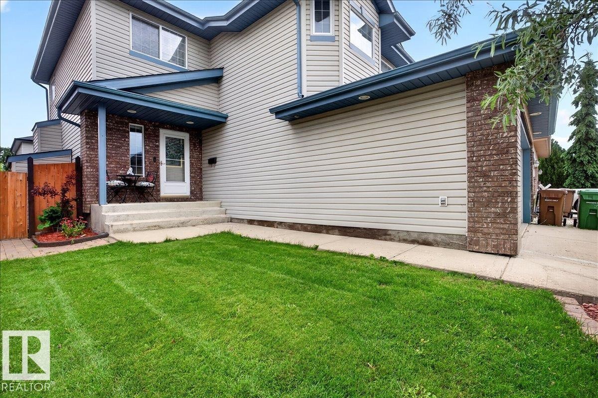 Exterior featuring light-colored siding and brick accents - 6 Norfolk Close, St. Albert, AB - Outdoor