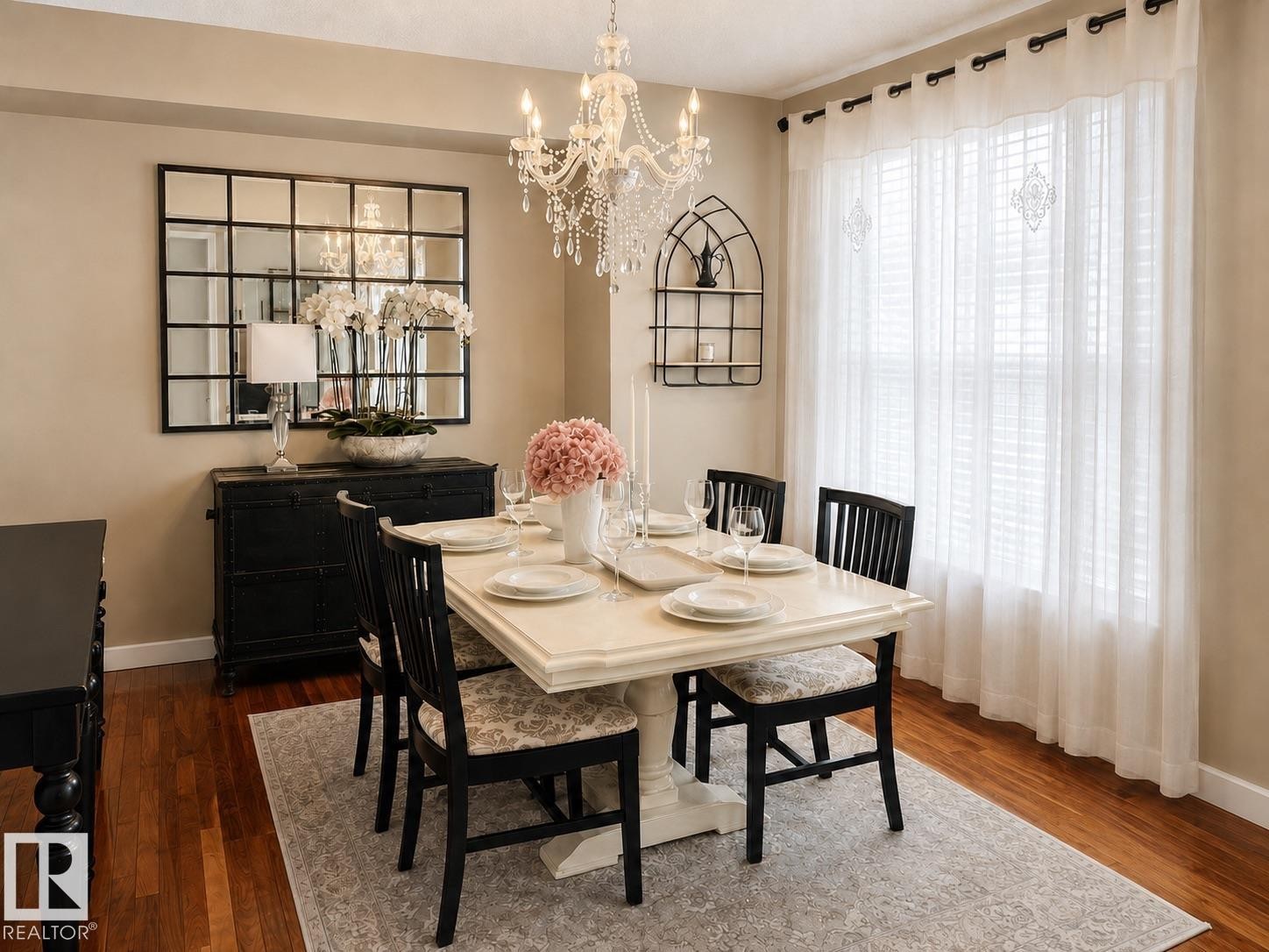 Dining area featuring wood-finish flooring, a chandelier, and a large window with white blinds - 2337 Frezenberg Avenue Nw, Edmonton, AB - Indoor Photo Showing Dining Room