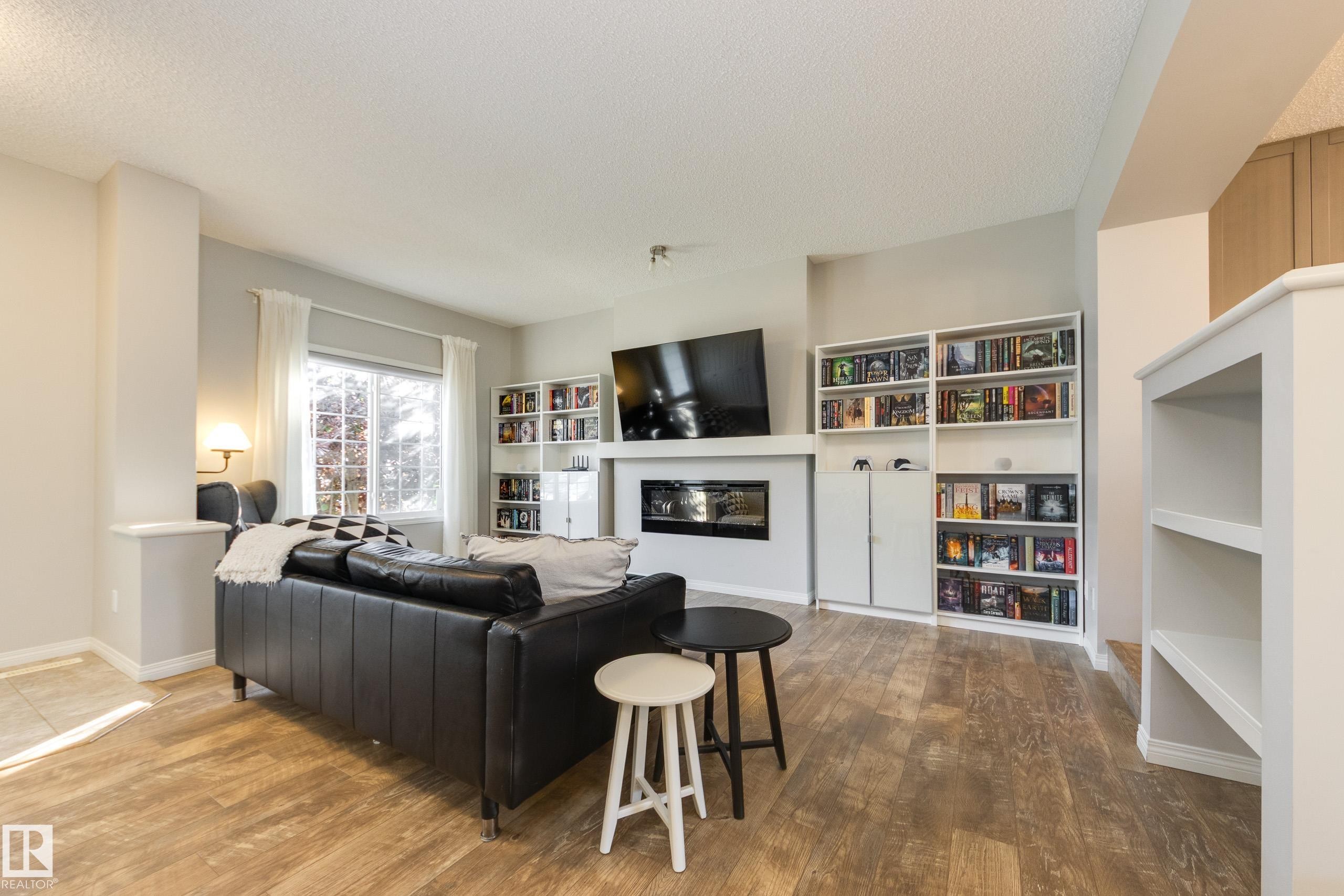 1241 Chappelle Boulevard Sw, Edmonton, AB - Indoor Photo Showing Living Room With Fireplace