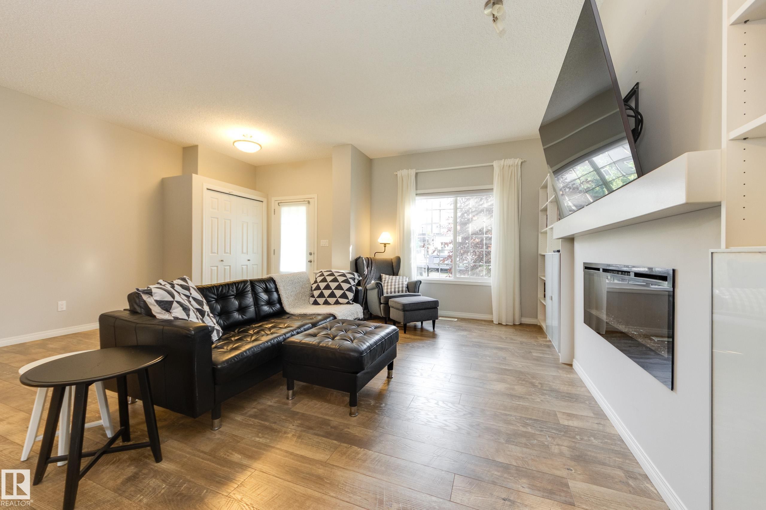 1241 Chappelle Boulevard Sw, Edmonton, AB - Indoor Photo Showing Living Room With Fireplace