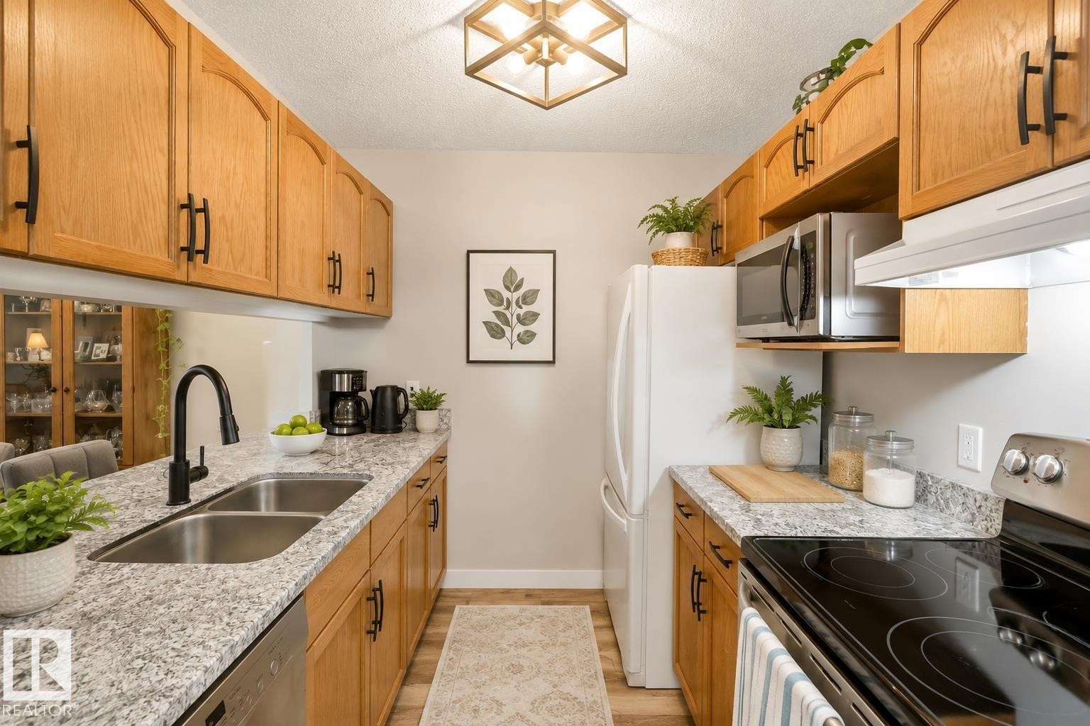 #329 17447 98A Av Nw, Edmonton, AB - Indoor Photo Showing Kitchen With Double Sink
