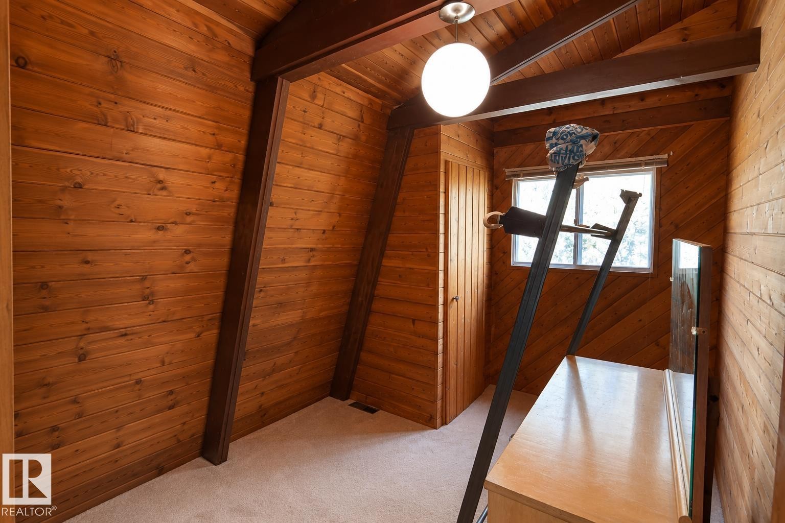 Wood-paneled room with vaulted ceilings and exposed wood beams - 329 60417 Range Road 124, Rural St. Paul County, AB - Indoor Photo Showing Other Room