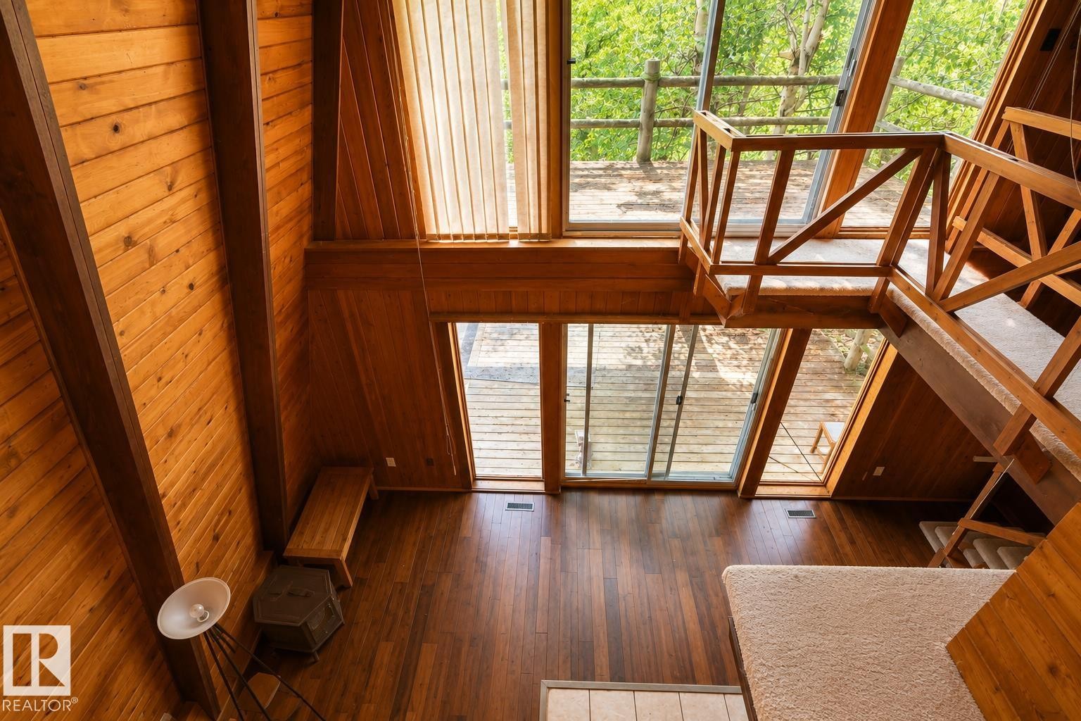 Vaulted wood-paneled ceiling with exposed beams - 329 60417 Range Road 124, Rural St. Paul County, AB - Indoor Photo Showing Other Room