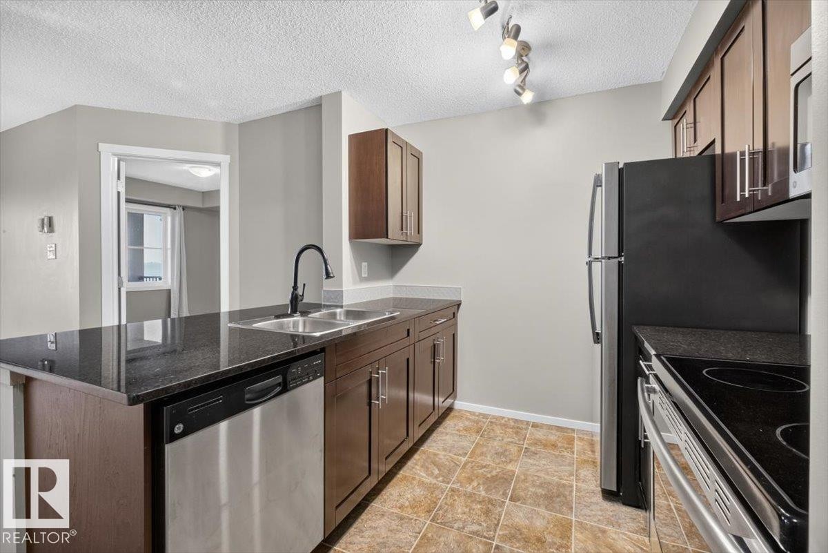 #204 18126 77 St Nw, Edmonton, AB - Indoor Photo Showing Kitchen With Stainless Steel Kitchen With Double Sink
