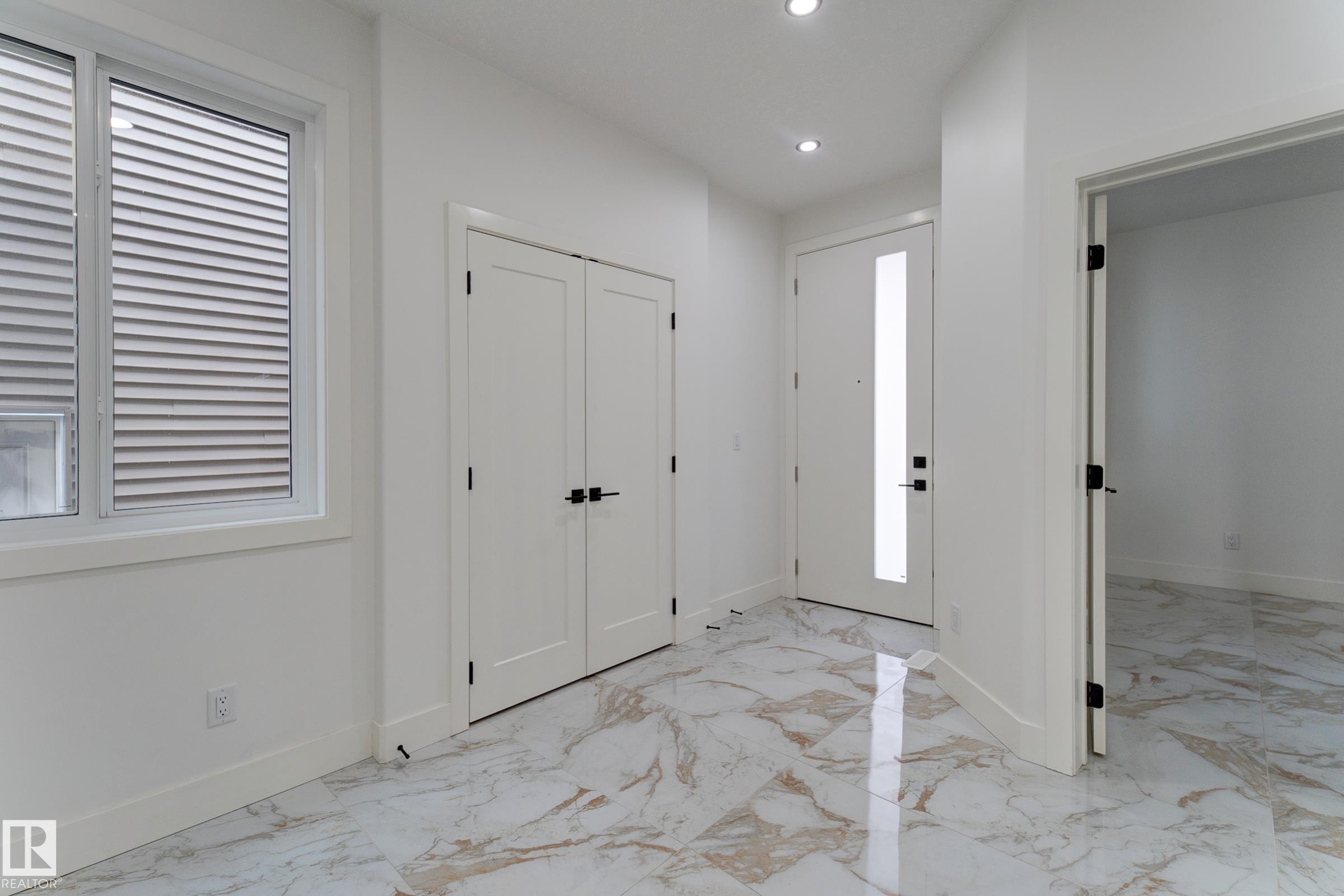 Entryway featuring polished marble-look tile flooring - 4723 17 Avenue Sw, Edmonton, AB - Indoor Photo Showing Other Room