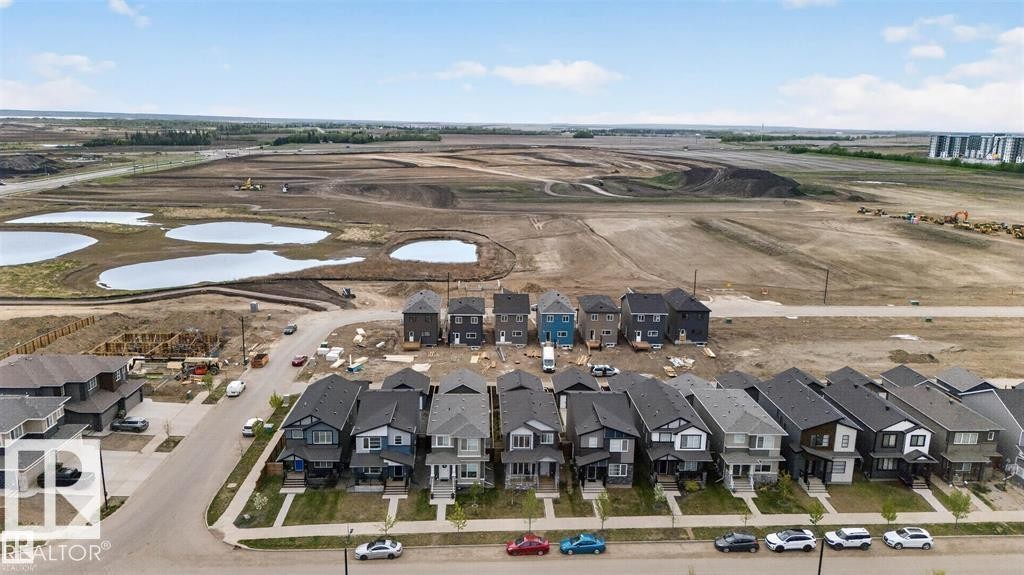 Newly constructed homes featuring contemporary architectural designs and varied exterior finishes - 43 River Birch Way, St. Albert, AB - Outdoor With View