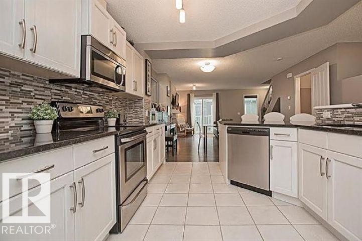 #95 4050 Savaryn Dr Sw, Edmonton, AB - Indoor Photo Showing Kitchen With Upgraded Kitchen