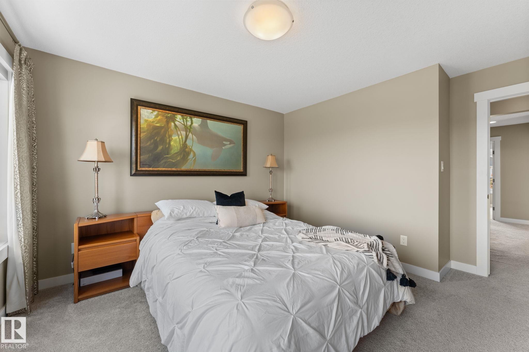 Carpeted room with neutral wall tones and white trim - 3413 Cameron Heights Cove Nw, Edmonton, AB - Indoor Photo Showing Bedroom