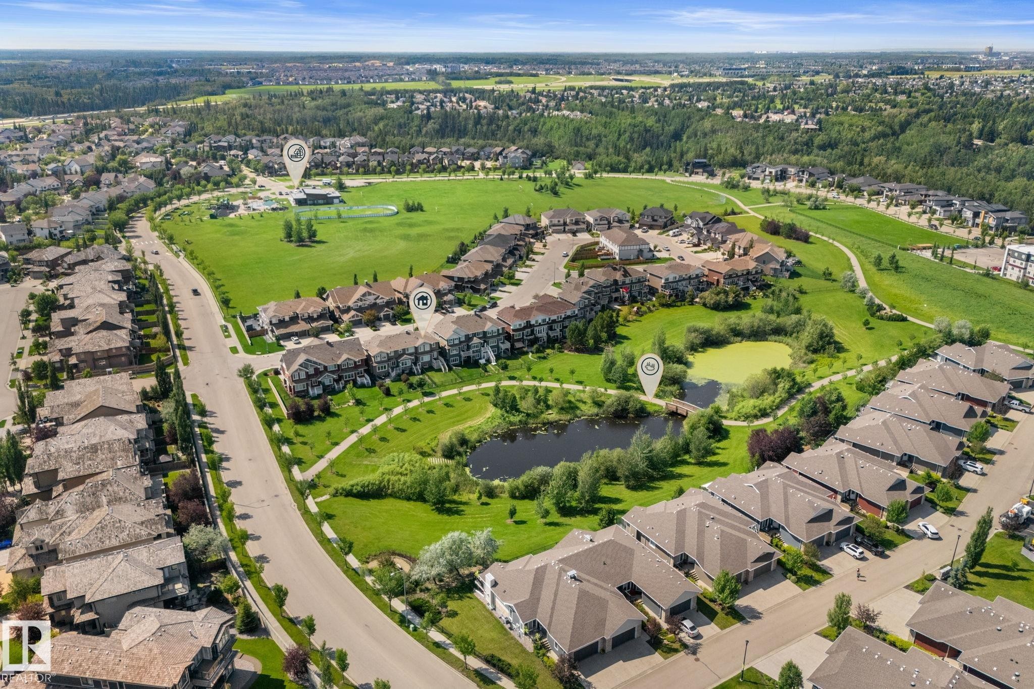 Aerial perspective showcasing a residential community with abundant green spaces - 3413 Cameron Heights Cove Nw, Edmonton, AB - Outdoor With View