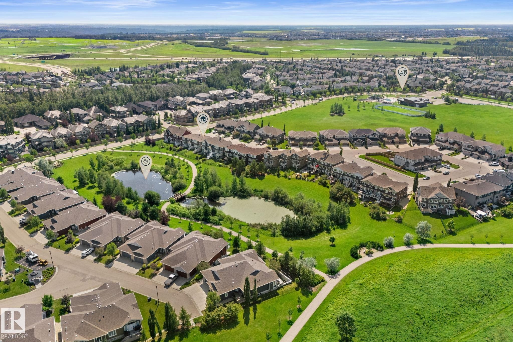 Expansive residential community featuring a variety of housing styles, abundant green spaces, and multiple ponds - 3413 Cameron Heights Cove Nw, Edmonton, AB - Outdoor With View