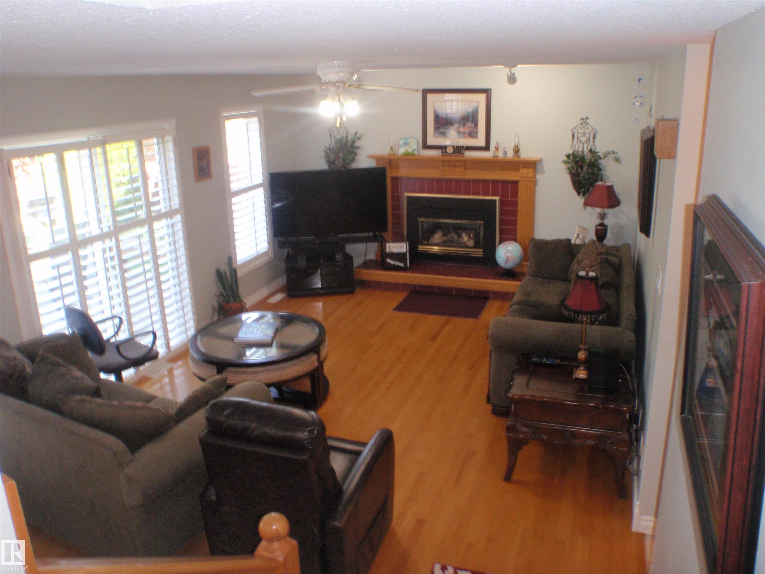 5802 53 Street, Barrhead, AB - Indoor Photo Showing Living Room With Fireplace