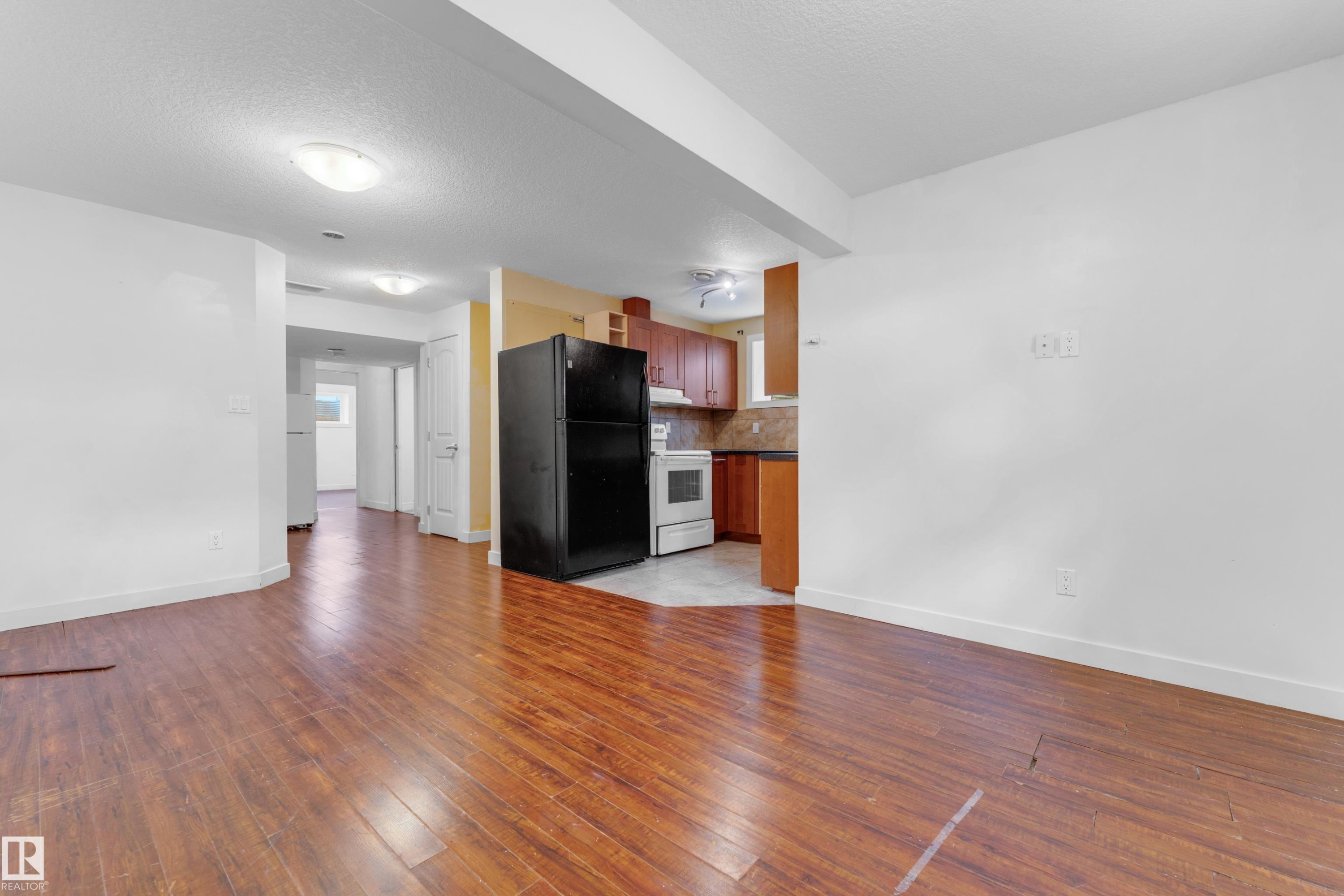 Open concept living area featuring wood-finish flooring - 11817 37 Street Nw, Edmonton, AB - Indoor
