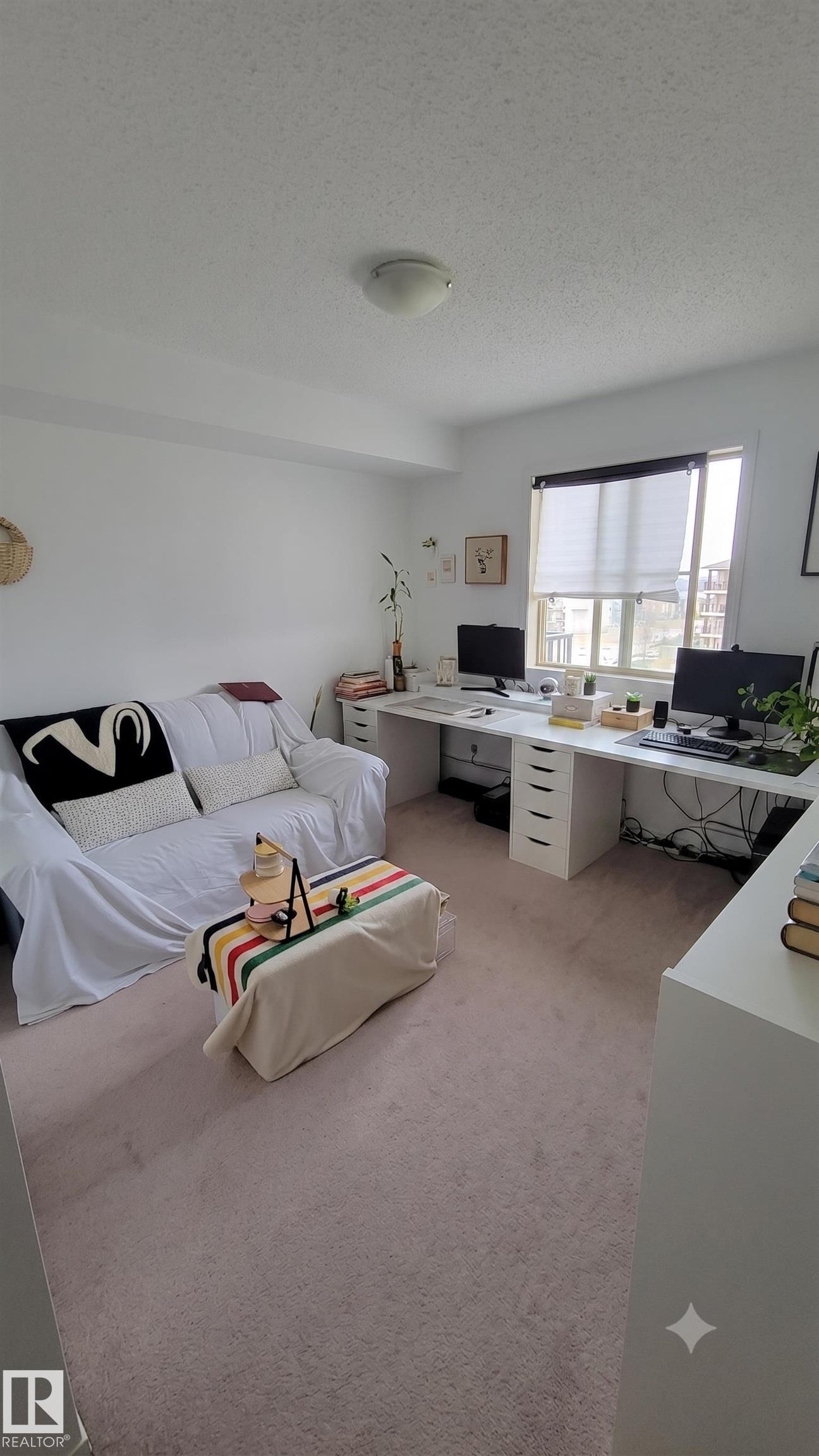 Neutral wall finishes and light-toned carpet flooring - #415 12045 22 Av Sw, Edmonton, AB - Indoor