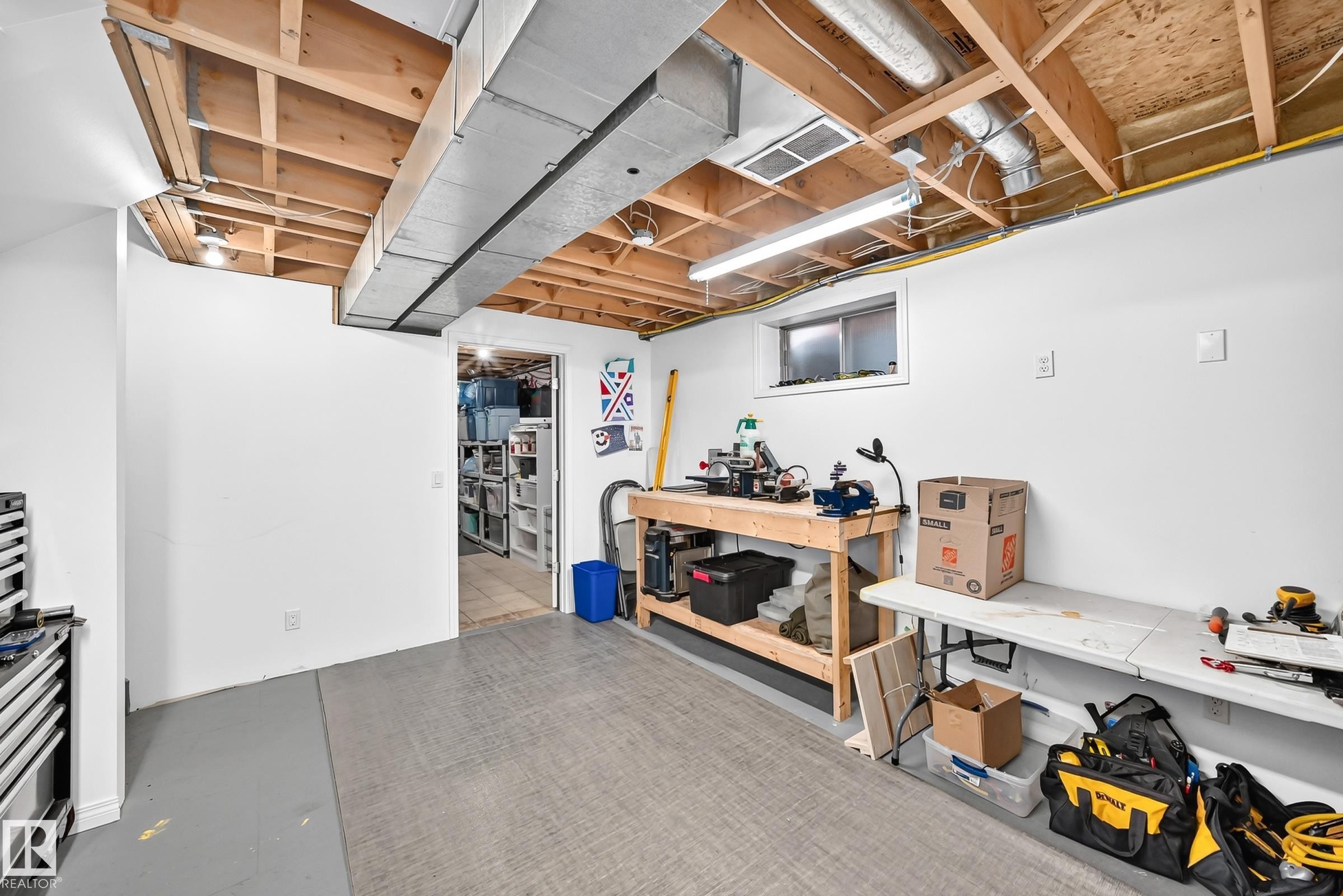 Unfinished basement space with exposed wooden joists and ductwork - 3729 131A Avenue Nw, Edmonton, AB - Indoor