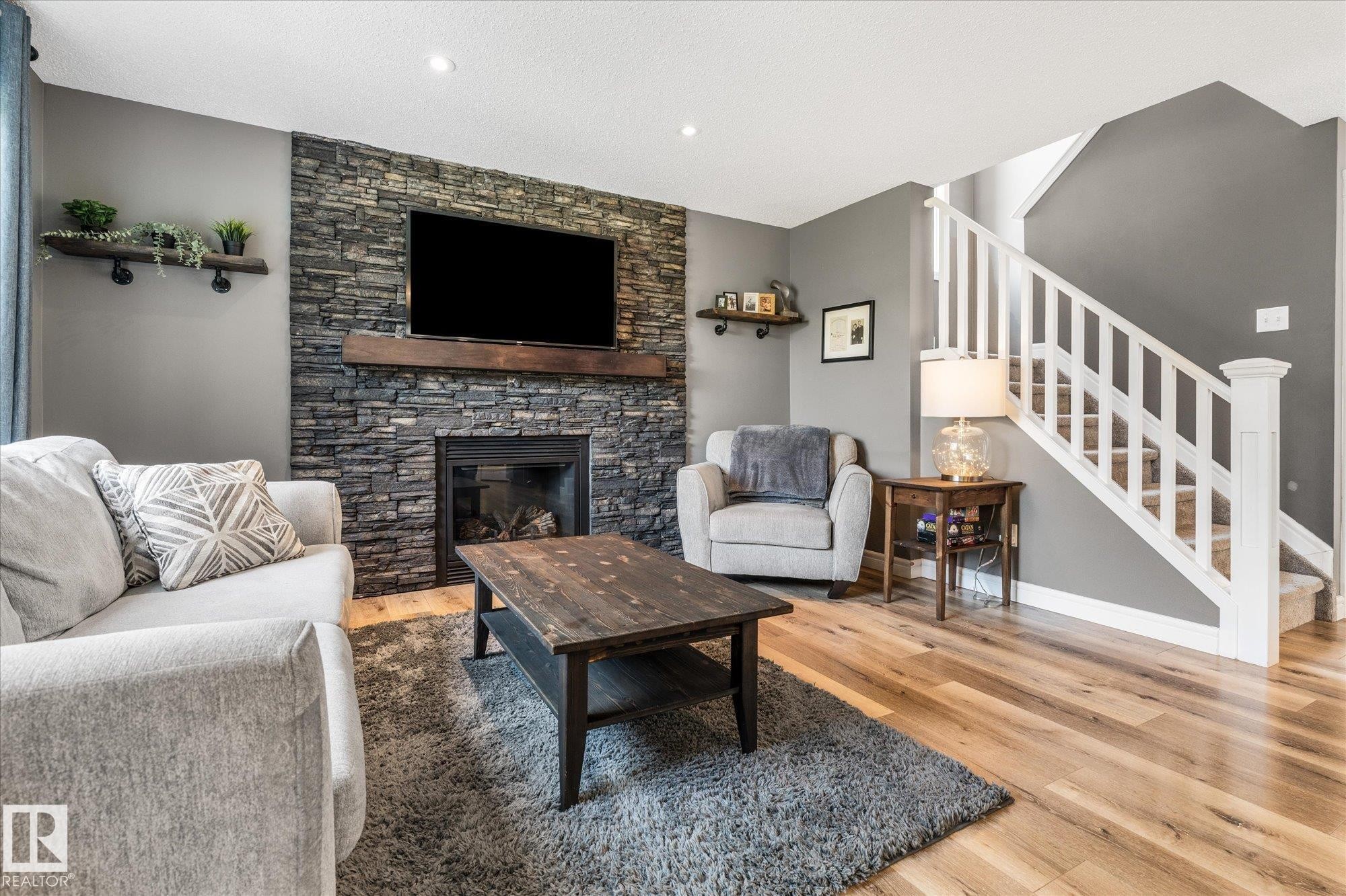41 Meadowview Landing, Spruce Grove, AB - Indoor Photo Showing Living Room With Fireplace