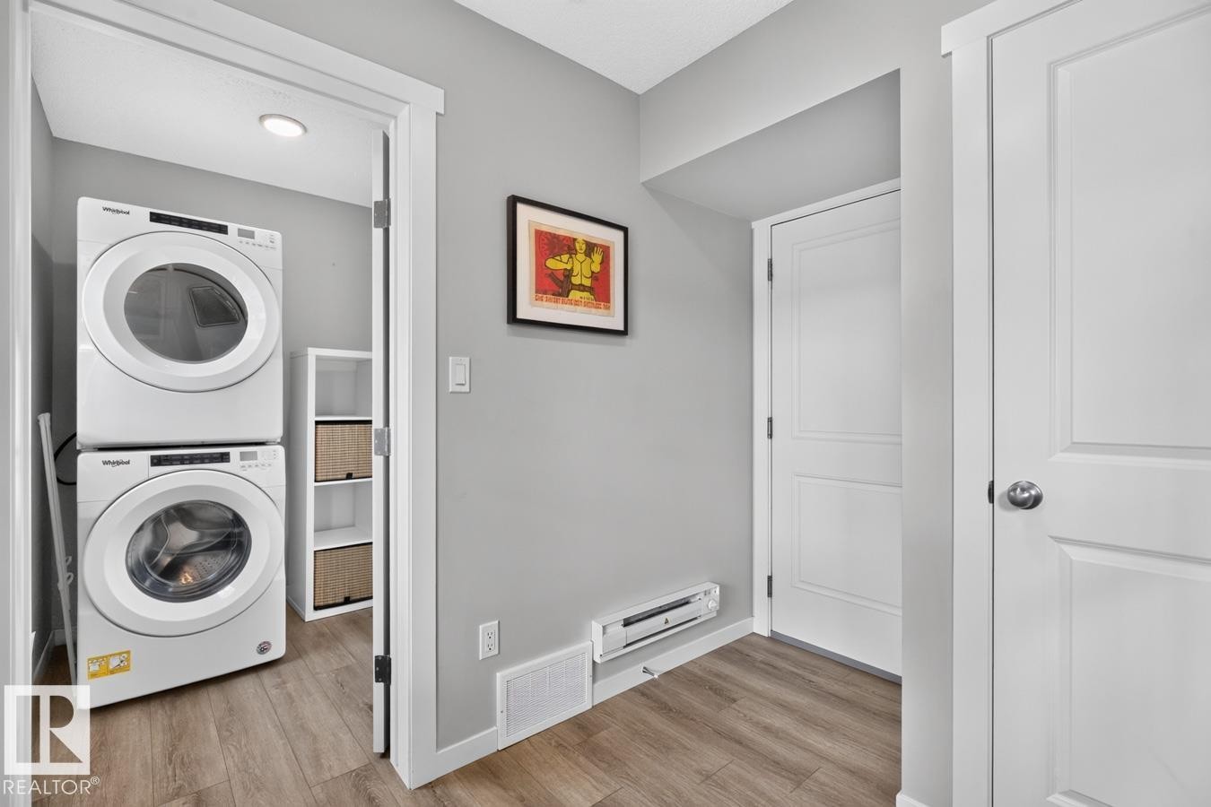 Main Floor Foyer of the Home leading to Laundry, Garage, and Staircase. - 1051 Cy Becker Road Nw, Edmonton, AB - Indoor Photo Showing Laundry Room