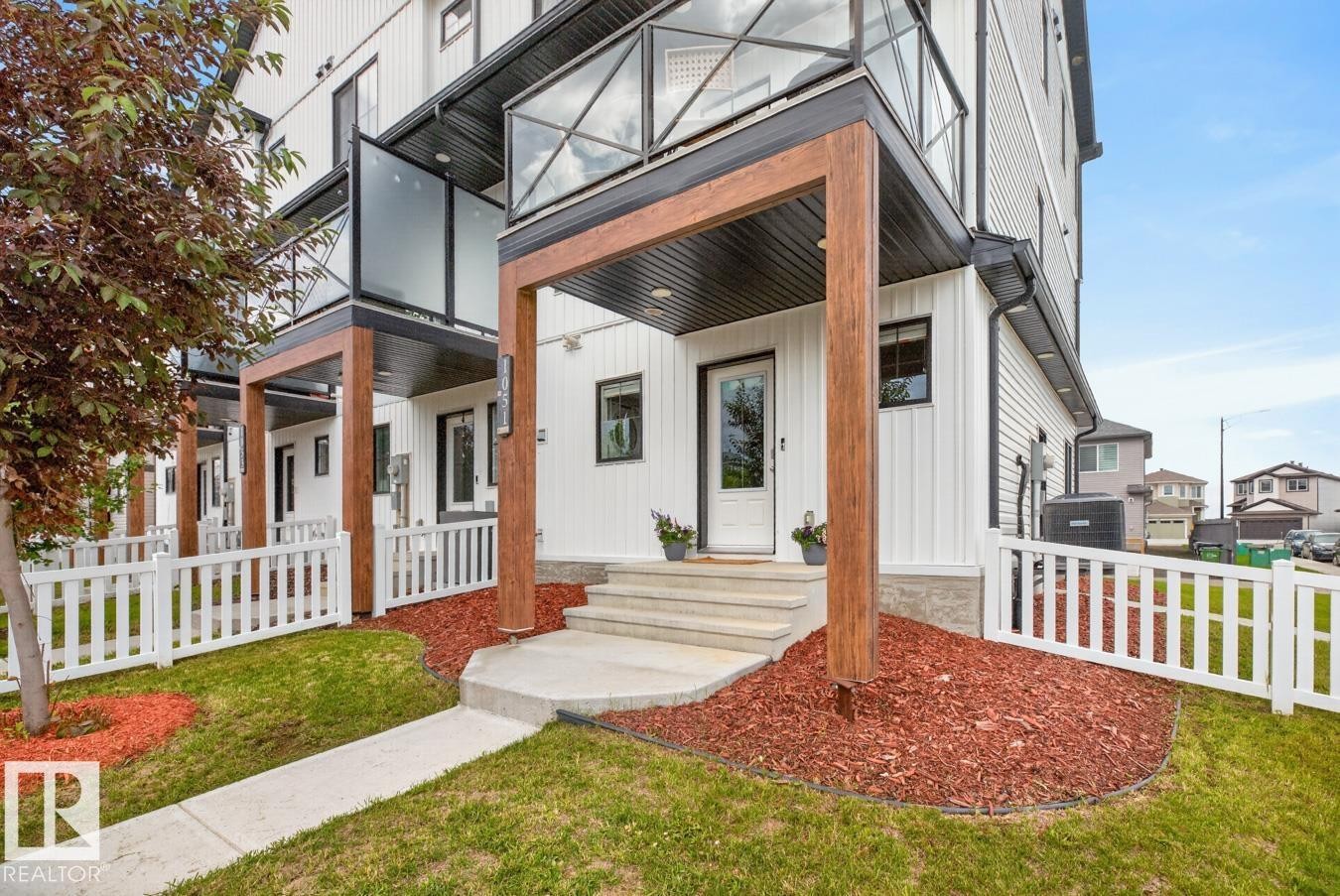 Front of Home located on a Landscaped Corner Lot. Fully Fenced with Front and Side Entrance. - 1051 Cy Becker Road Nw, Edmonton, AB - Outdoor With Facade