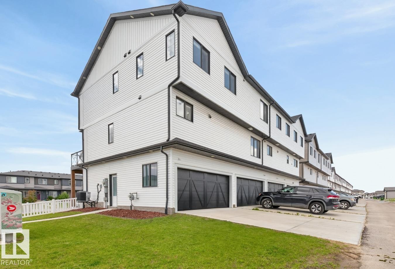 Exterior Back of House featuring Double Garage and Parking Pad. - 1051 Cy Becker Road Nw, Edmonton, AB - Outdoor