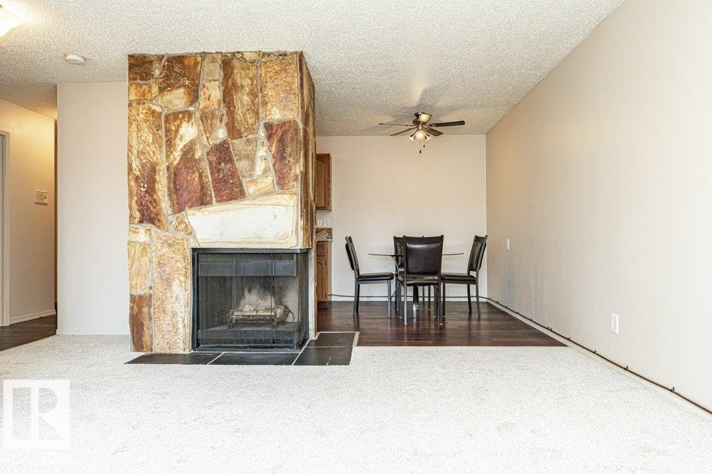 #310 14004 26 St Nw, Edmonton, AB - Indoor Photo Showing Living Room With Fireplace