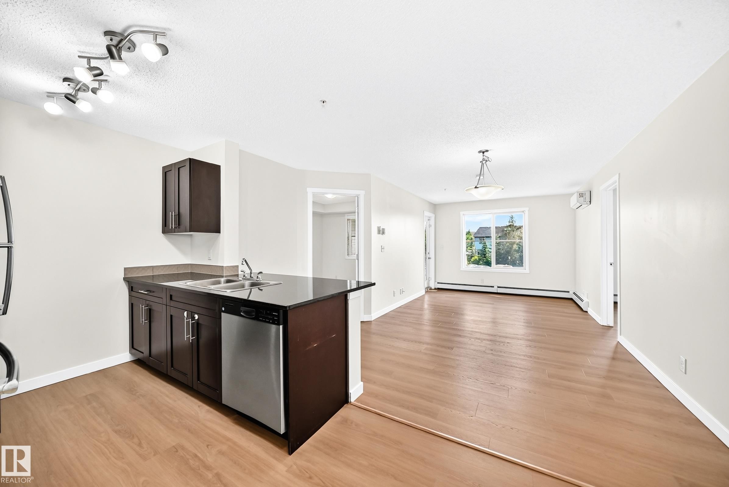 #206 3315 James Mowatt Tr Sw, Edmonton, AB - Indoor Photo Showing Kitchen With Double Sink