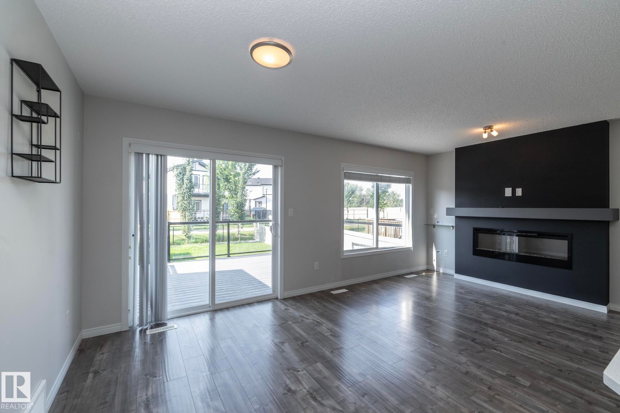 5233 Crabapple Link Sw, Edmonton, AB - Indoor Photo Showing Living Room With Fireplace