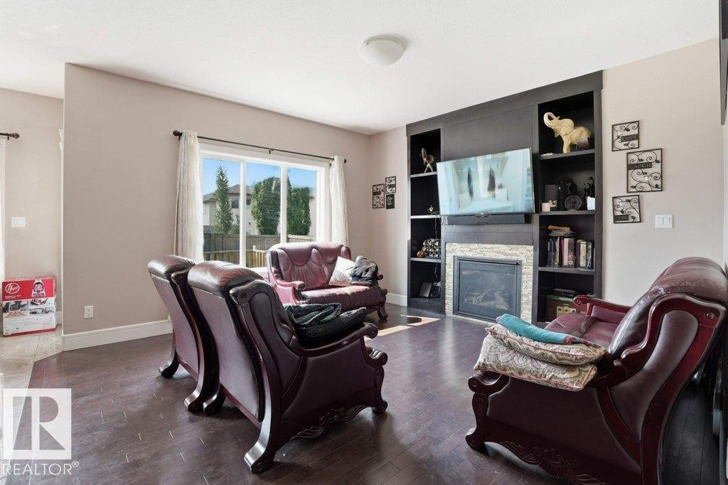 Living room - 258 Albany Drive Nw, Edmonton, AB - Indoor Photo Showing Living Room With Fireplace